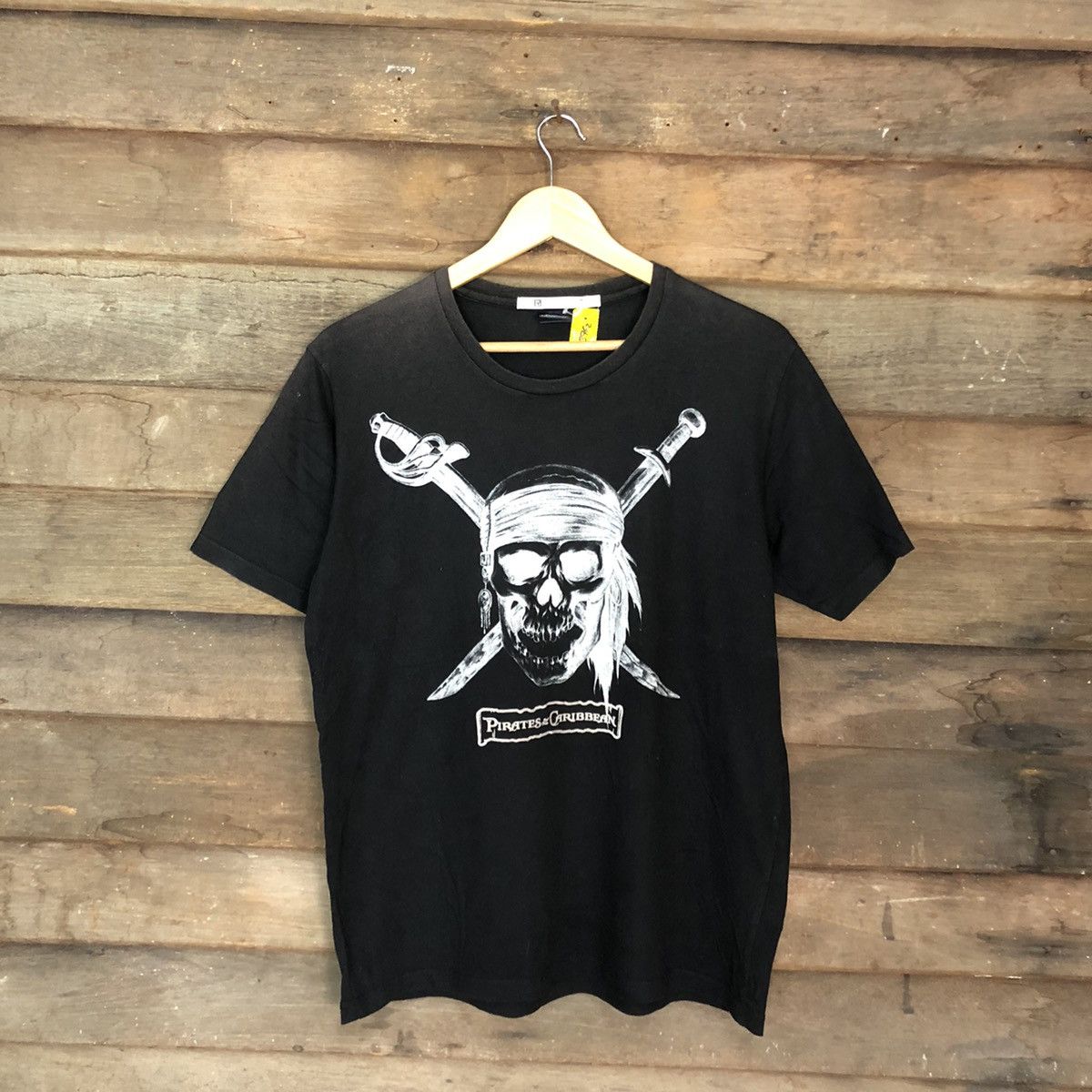 image of Cartoon Network x Movie Pirates Of Carribean X Uniqlo Black Tshirt 3962, Men's (Size Medium)