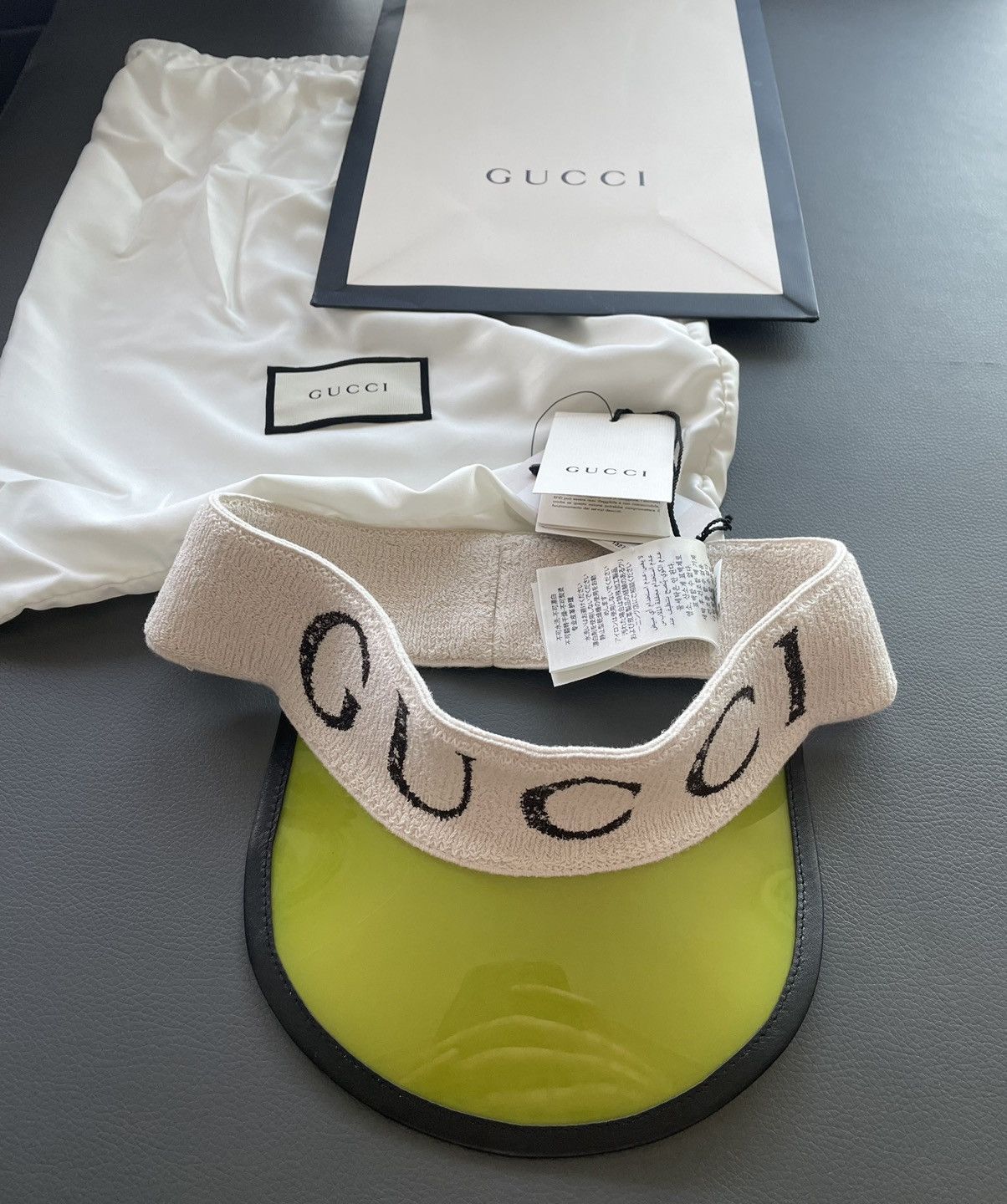 image of Limited Super Runway Vinyl Gucci Logo Elastic Visor Hat in Yellow, Men's