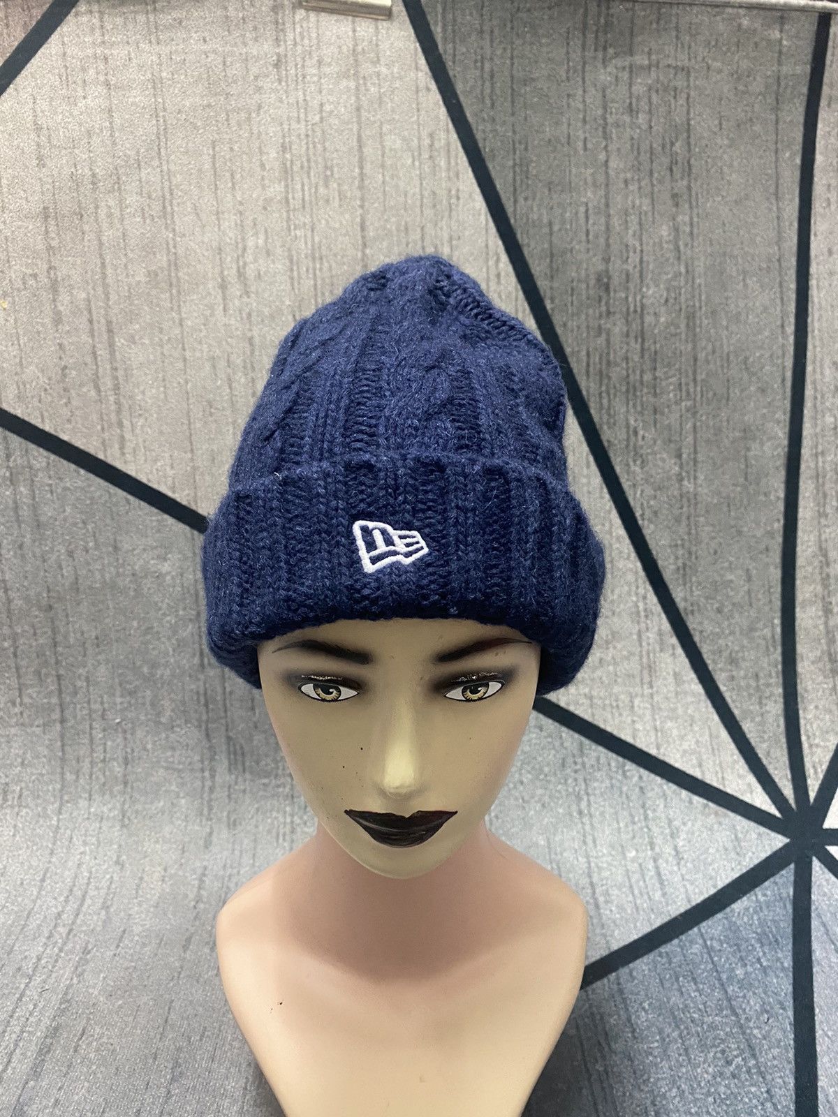 image of New Era Knitted Small Embroidered Logo Beanie Hat in Blue Black, Men's