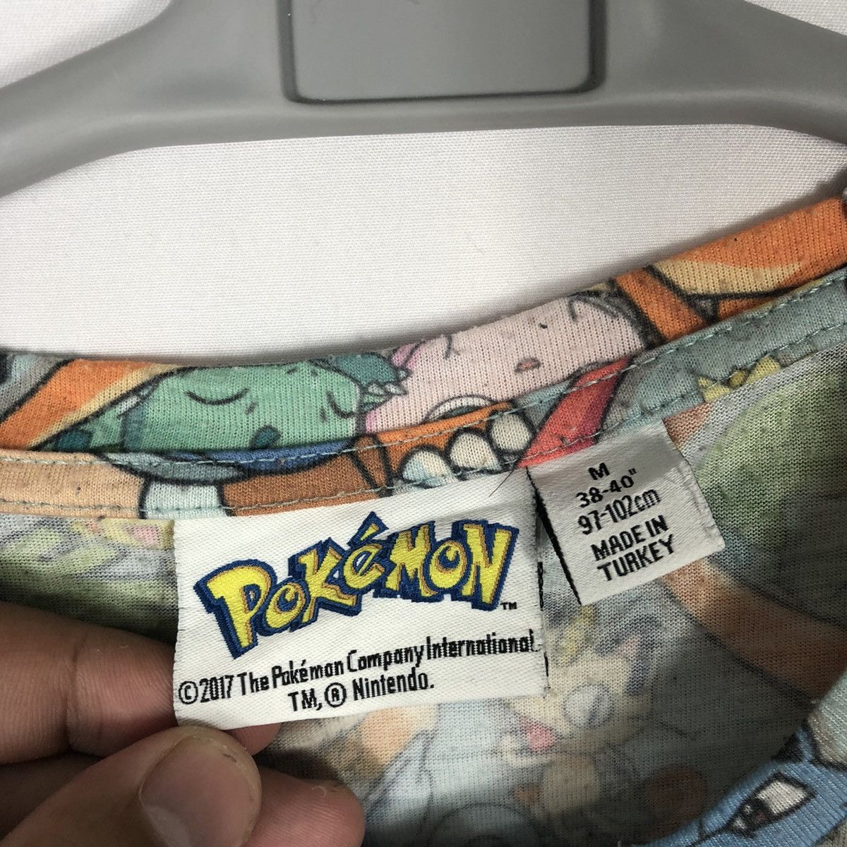 Nintendo 2017 Pokemon All Character AOP Polyster Tee Size US L / EU 52-54 / 3 - 10 Thumbnail