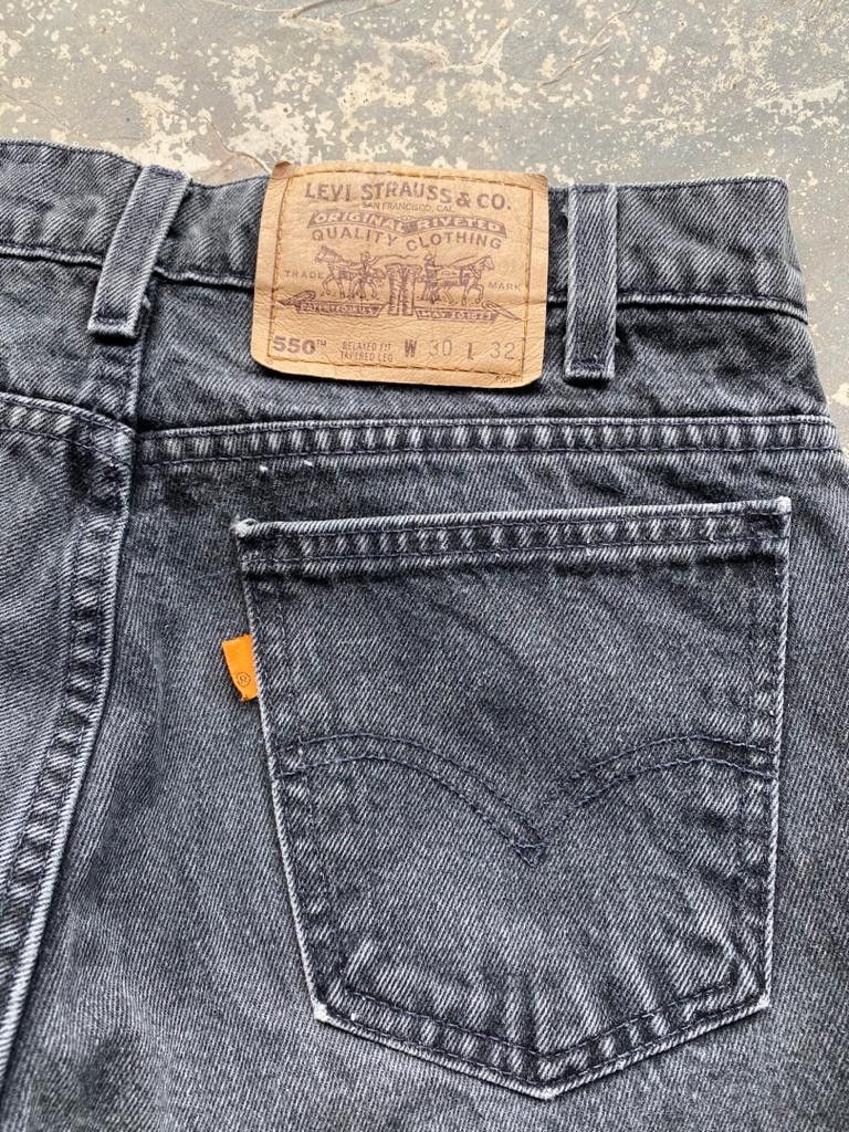 image of 90's Vintage Levis Blank Orange Tab Jeans Release Hem in Faded Black, Men's (Size 29)
