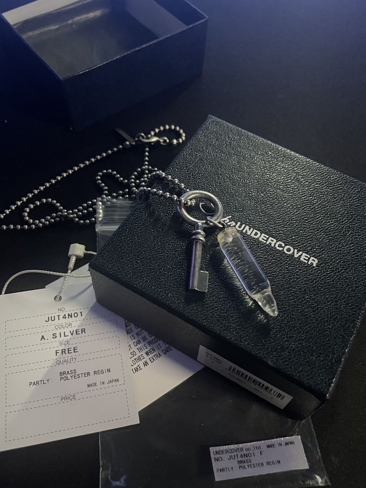 image of Undercover Crystal Bullet Key Necklace in Silver, Men's
