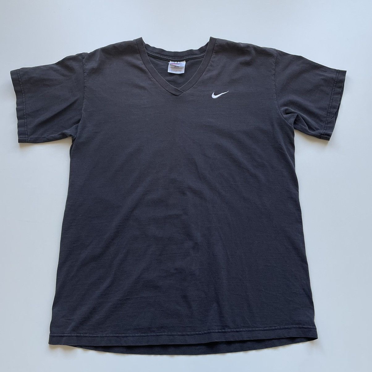 image of 90's Nike Embroidered Swoosh V Neck. T Shirt Faded in Black, Men's (Size Large)