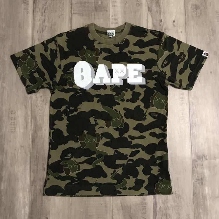 Bape × Kaws × Nigo BAPE x kaws bendy 1st camo green T-shirt a bathing ape NIGO Size US S / EU 44-46 / 1 - 1 Thumbnail