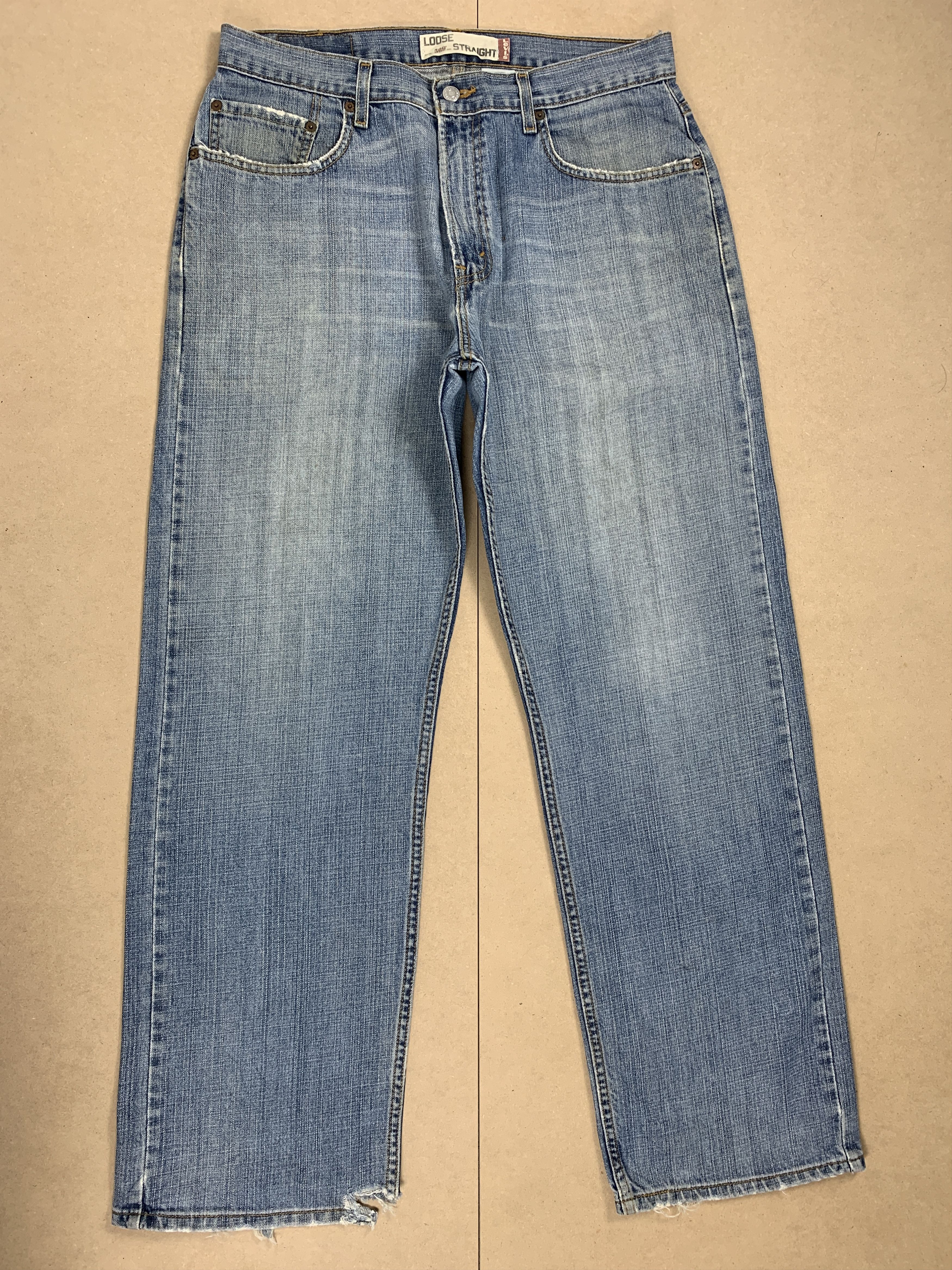 image of Levis 569 Straight Cut Distressed Mid Wash Jeans in Midwash, Men's (Size 34)