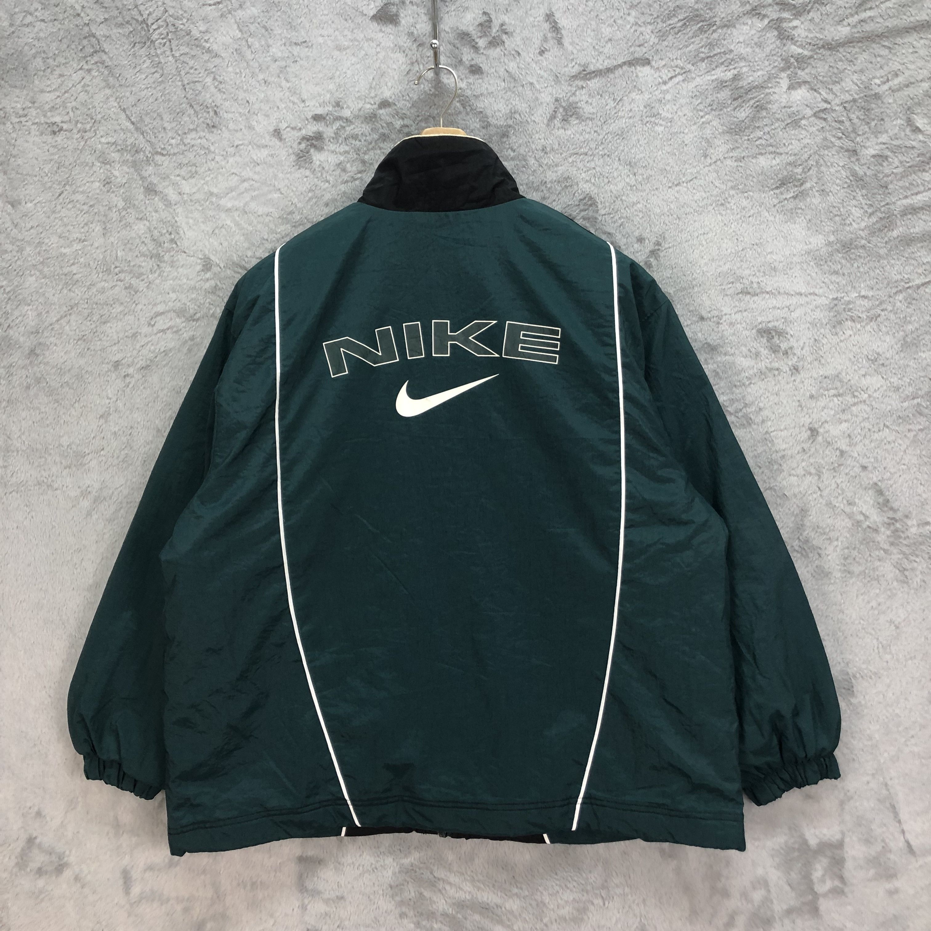 Nike jacket logo on back best sale