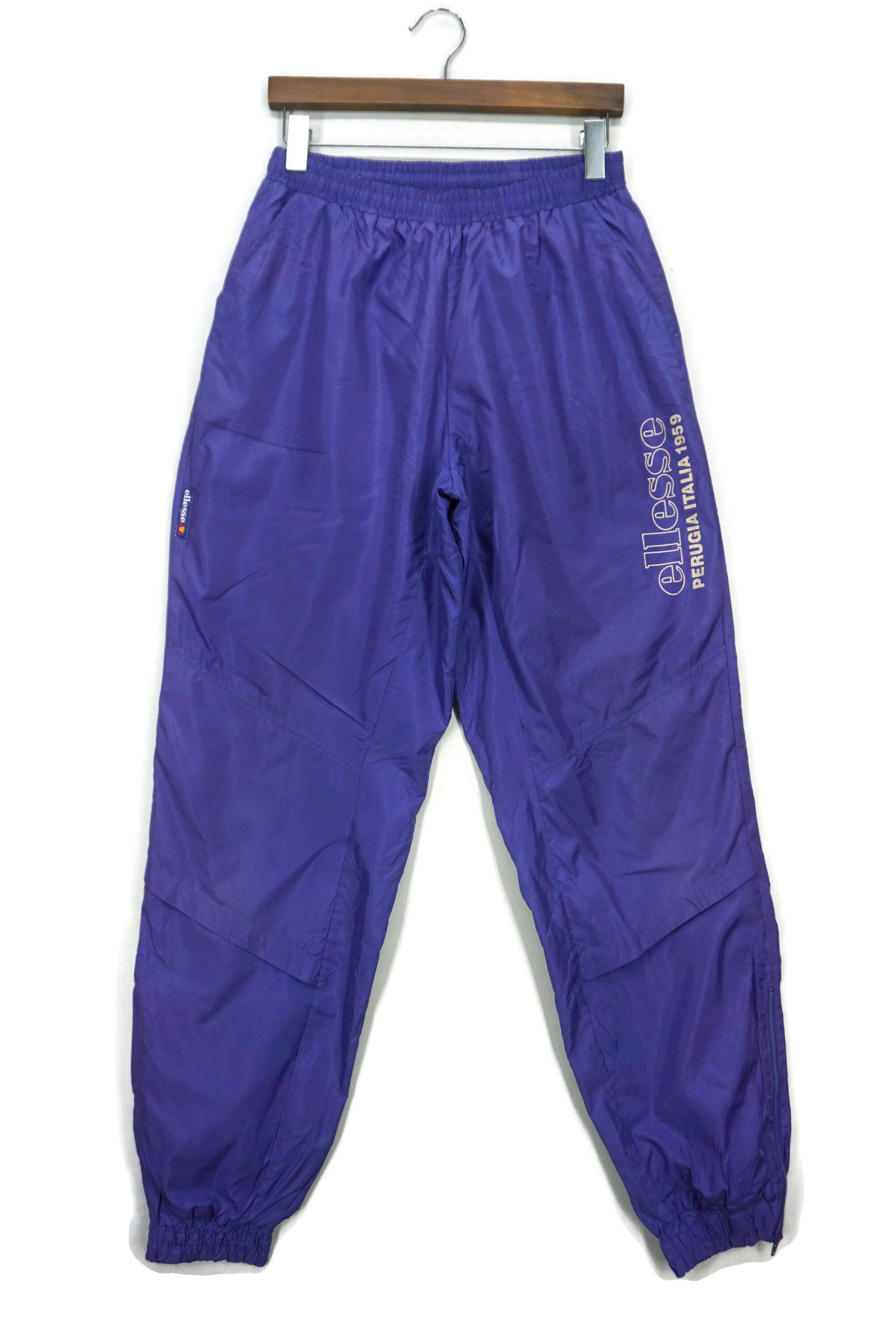 image of Ellesse x Vintage Shiny Windbreaker Track Bottom Pants Made By Jaspo Fabrics in Blue Purple (Size 3