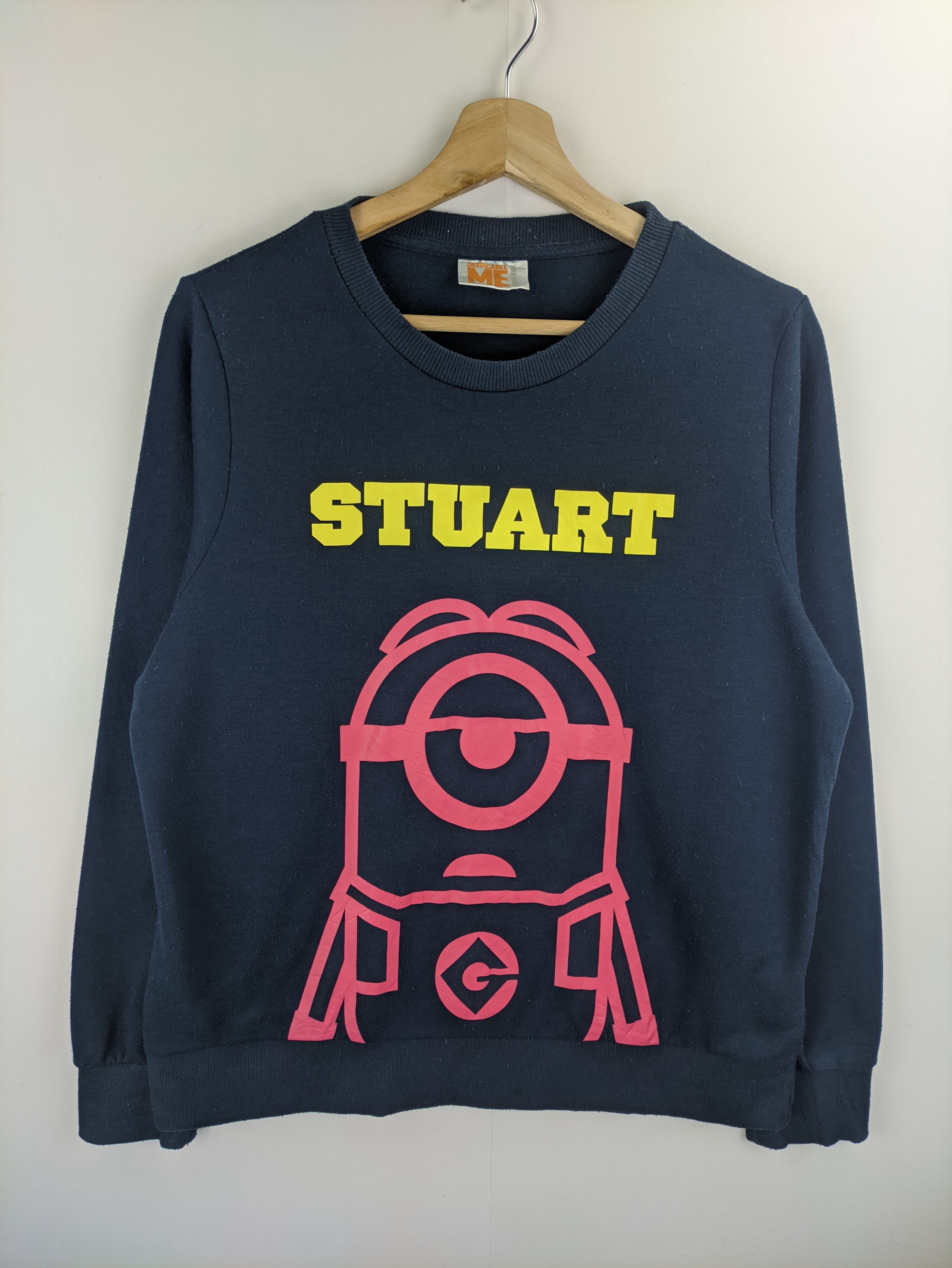 image of Cartoon Network x Disney Stealssweatshirt Despicable Me Stuart in Dark Blue, Men's (Size Medium)