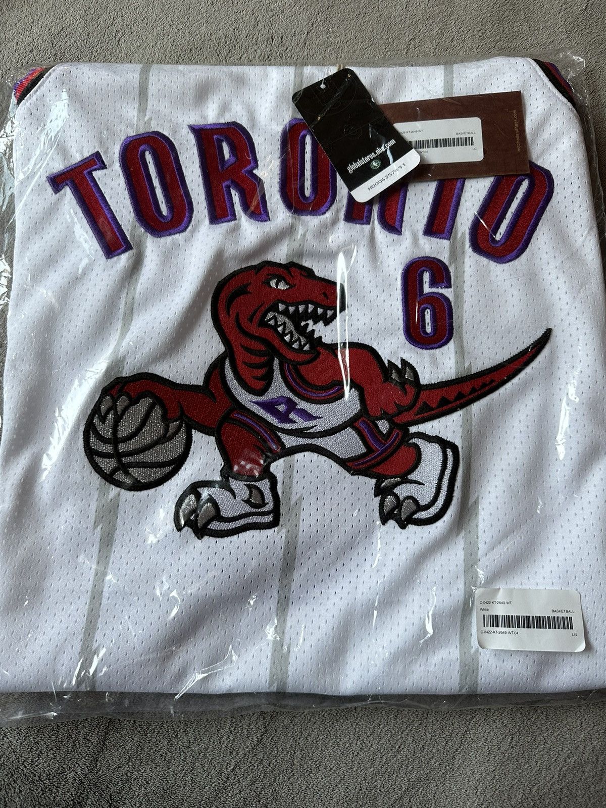 image of Mitchell Ness x NBA Ovo Toronto Raptors X Mitchell & Ness Basketball Jersey in White (Size Large)