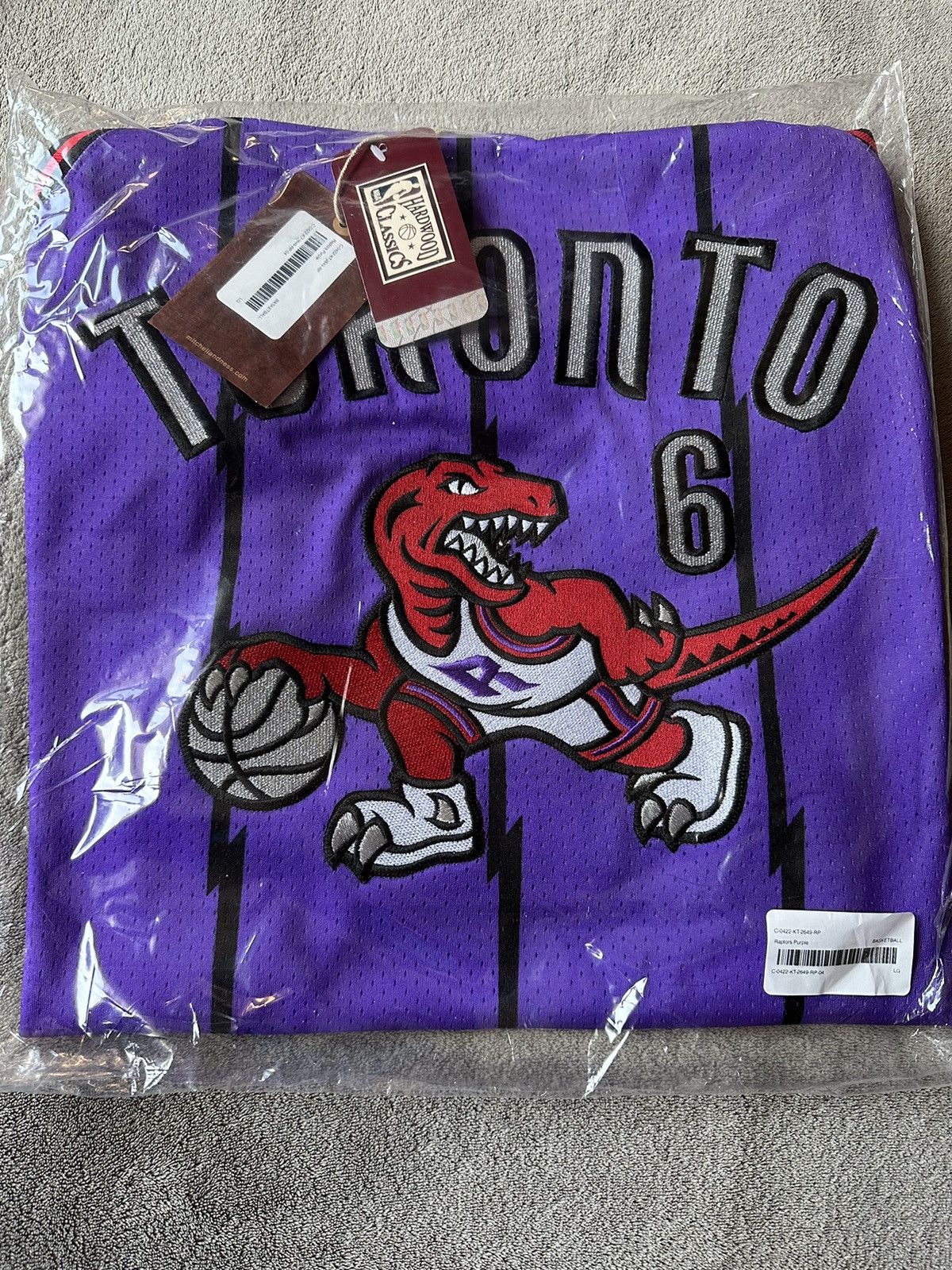 image of Mitchell Ness x NBA Ovo Toronto Raptors X Mitchell & Ness Basketball Jersey in Purple (Size Large)