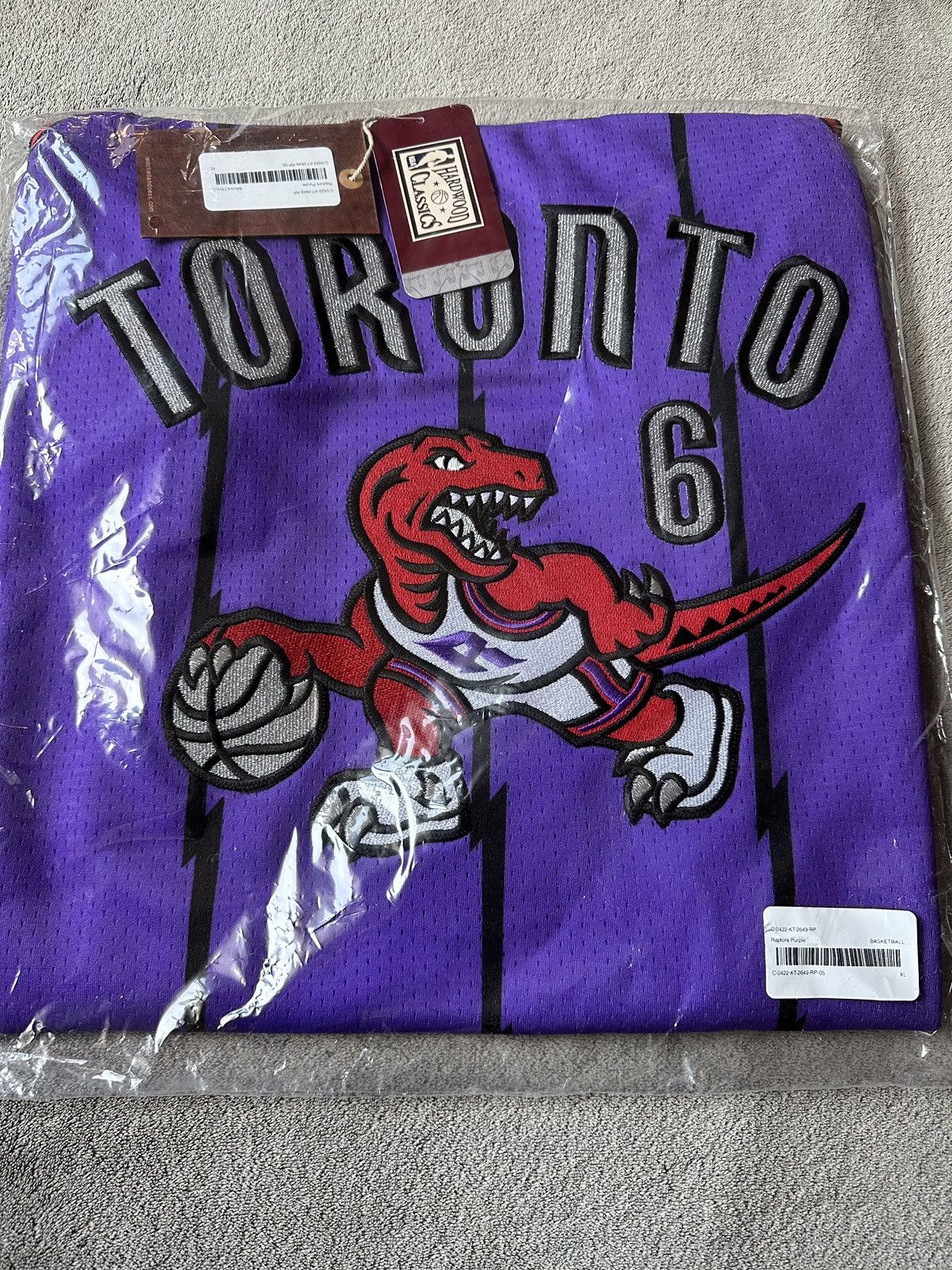 Image of Mitchell Ness x NBA Ovo Toronto Raptors X Mitchell & Ness Basketball Jersey in Purple (Size XL)