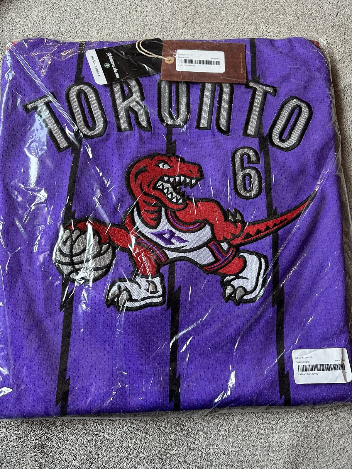 image of Mitchell Ness x NBA Ovo Toronto Raptors X Mitchell & Ness Basketball Jersey in Purple (Size 2XL)