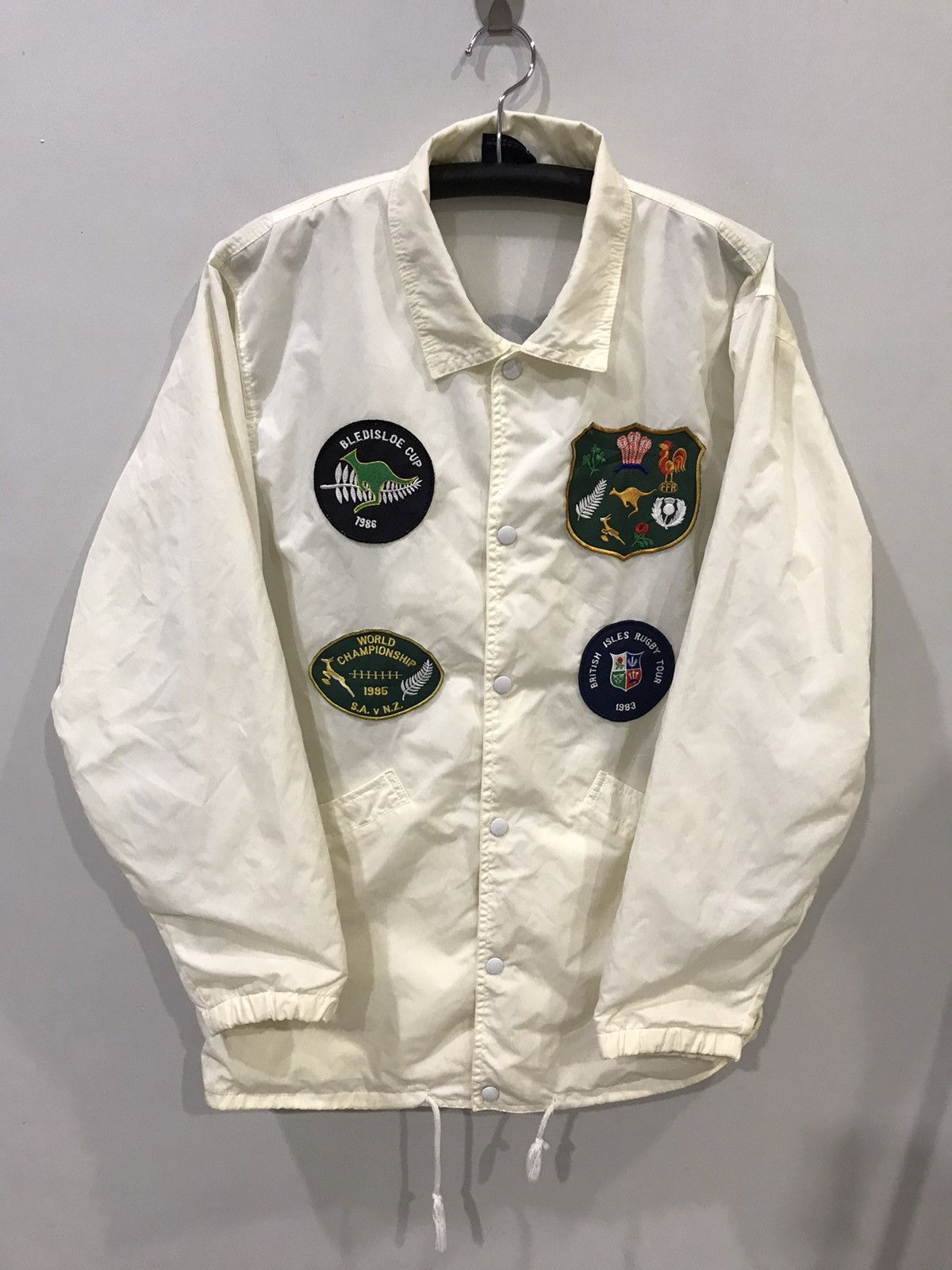 image of Canterbury Of New Zealand x Vintage Canterbury 80's Patches Spellout Logo Raincoat in Light Cream (