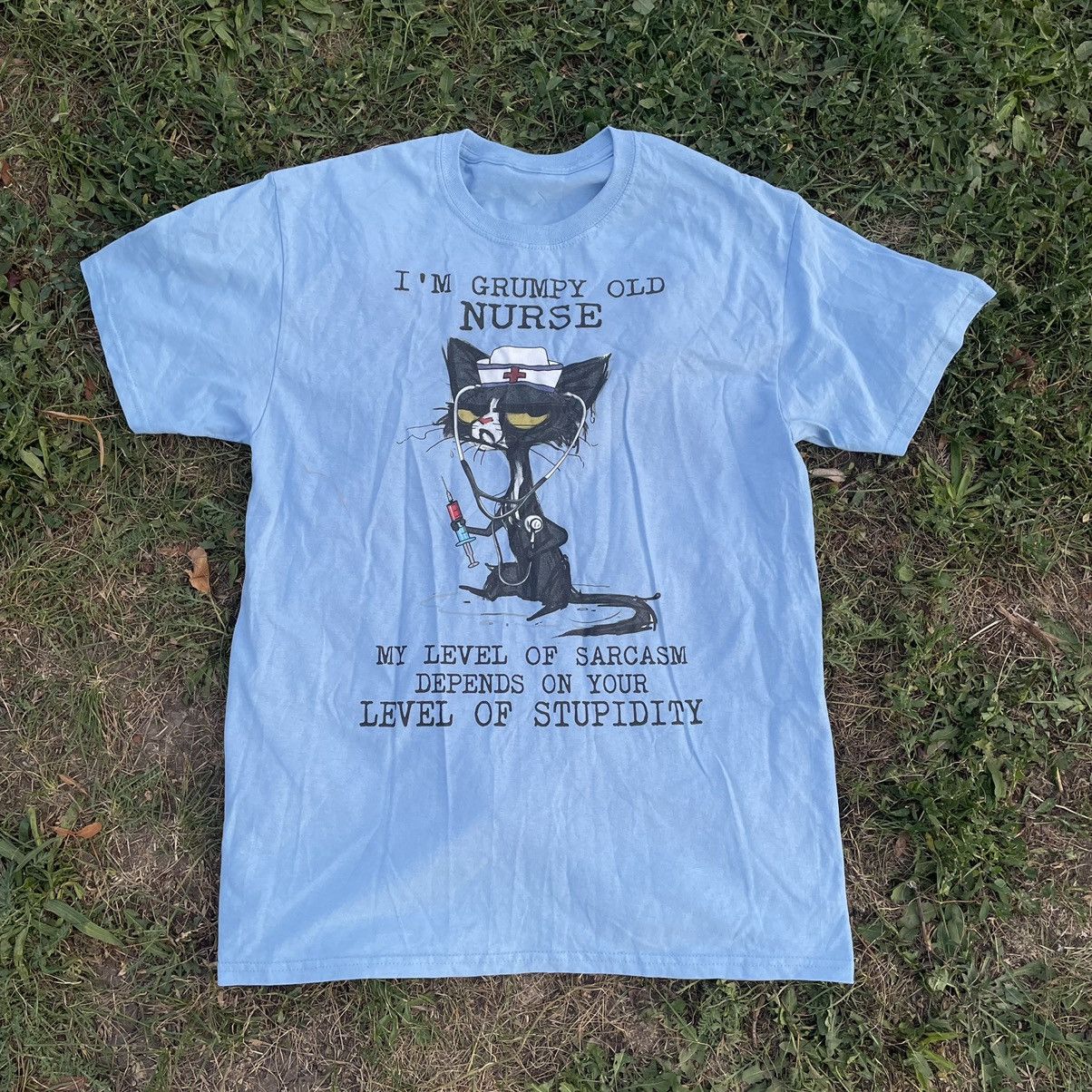 image of Y2K Adult “Stupidity Cat Tee” Humor Tee, Men's (Size Medium)