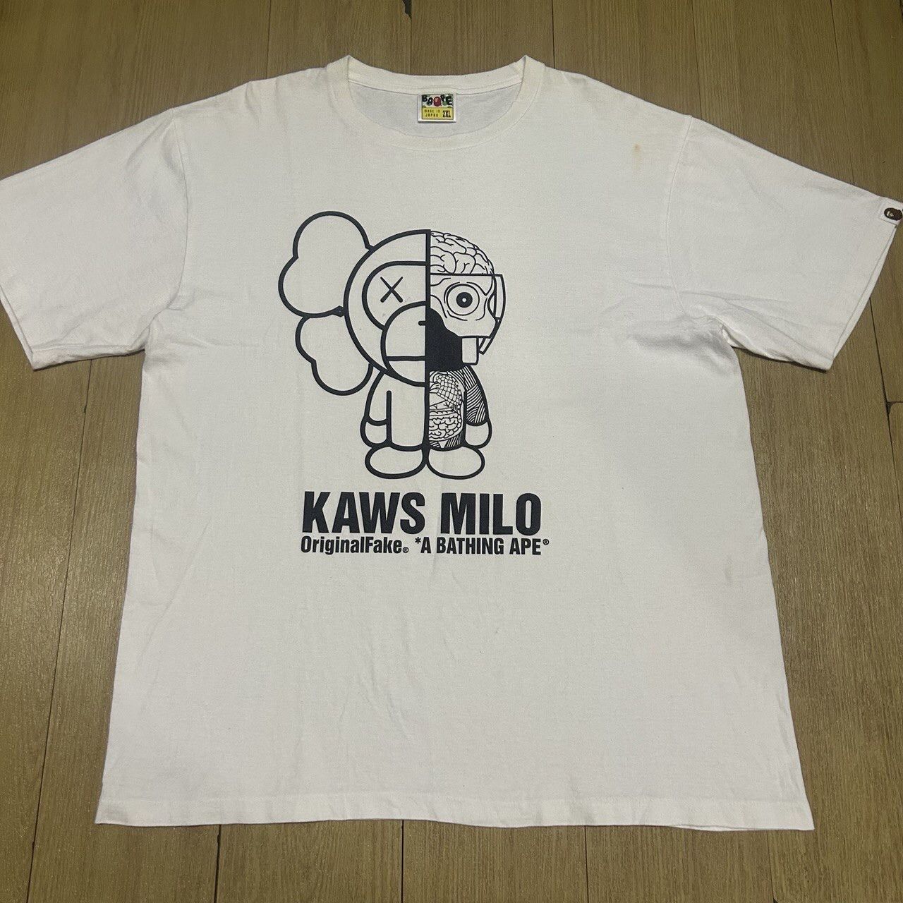 image of Bape x Kaws Baby Milo X Kaws X Original Fake Companion T-Shirts in White, Men's (Size XL)