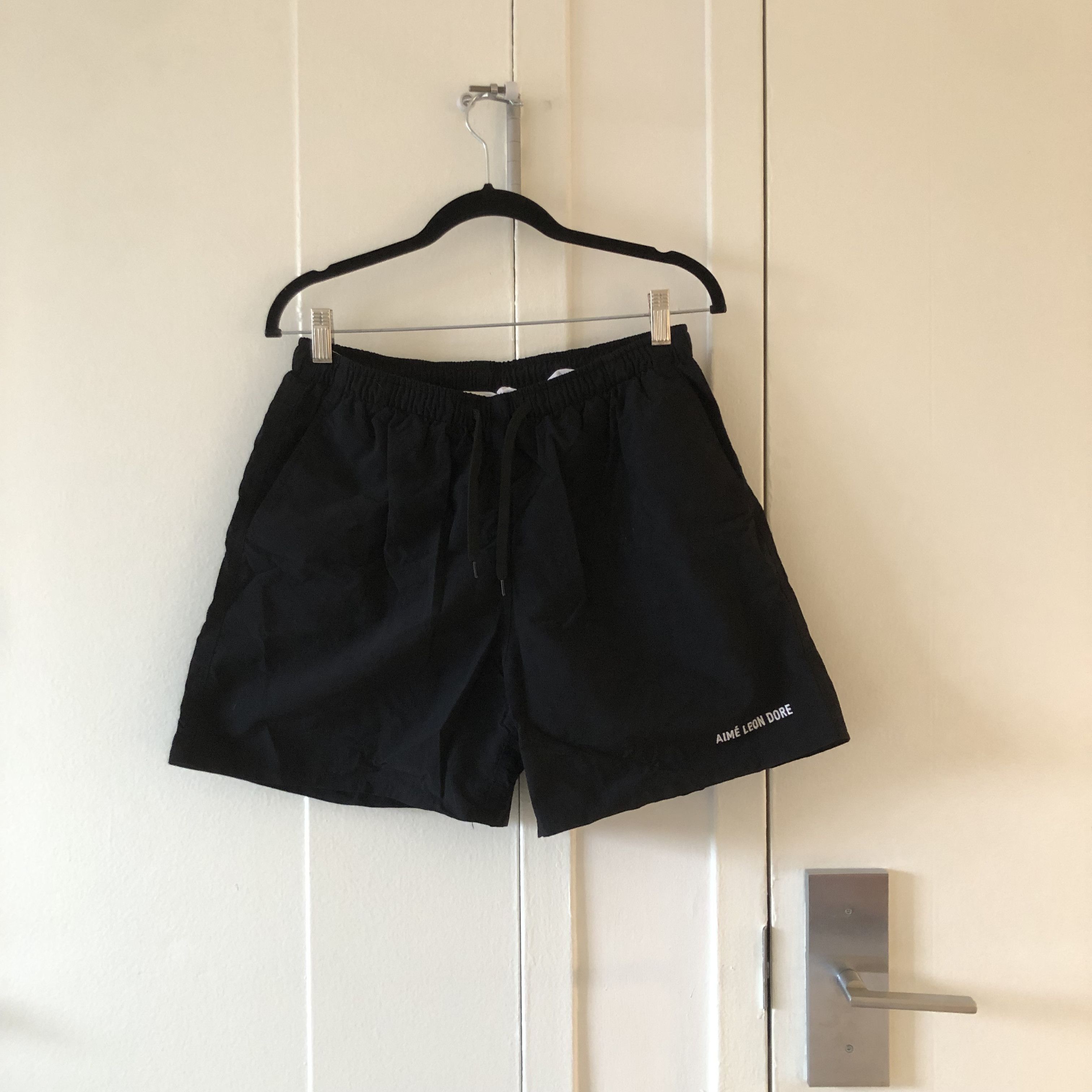 image of Aime Leon Dore Logo Nylon Shorts in Black, Men's (Size 32)