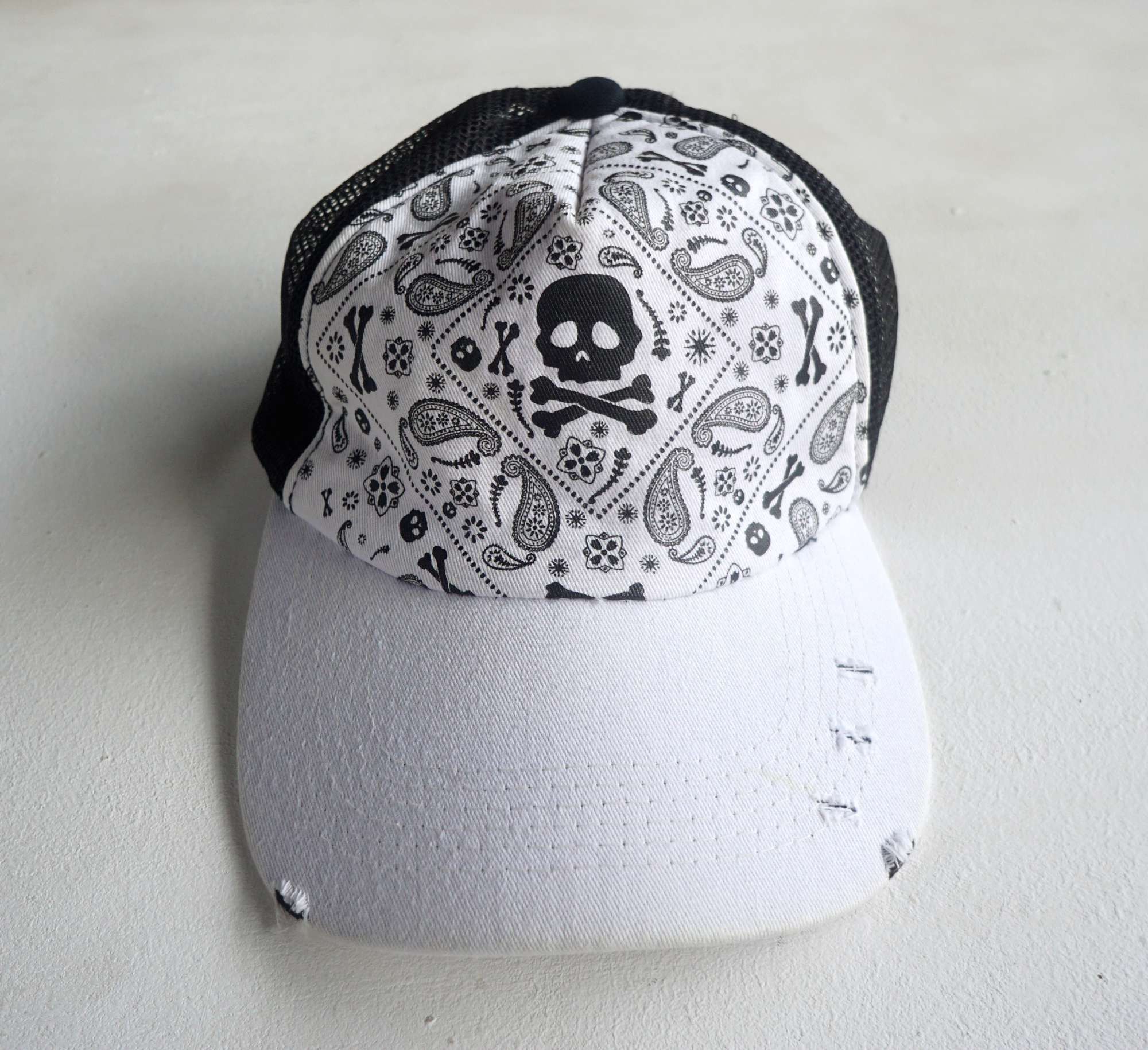 image of Skulls x Trucker Hat Shisky Skull & Paisley Ripped Trucker Hat in Black/White, Men's
