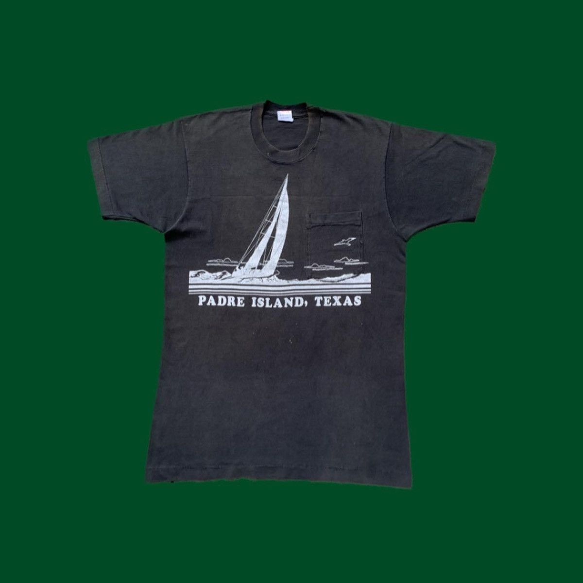 image of Crazy Shirts x Mambo Vintage Padre Island Texas Single Stitch Pocket Tshirt in Faded Black (Size La