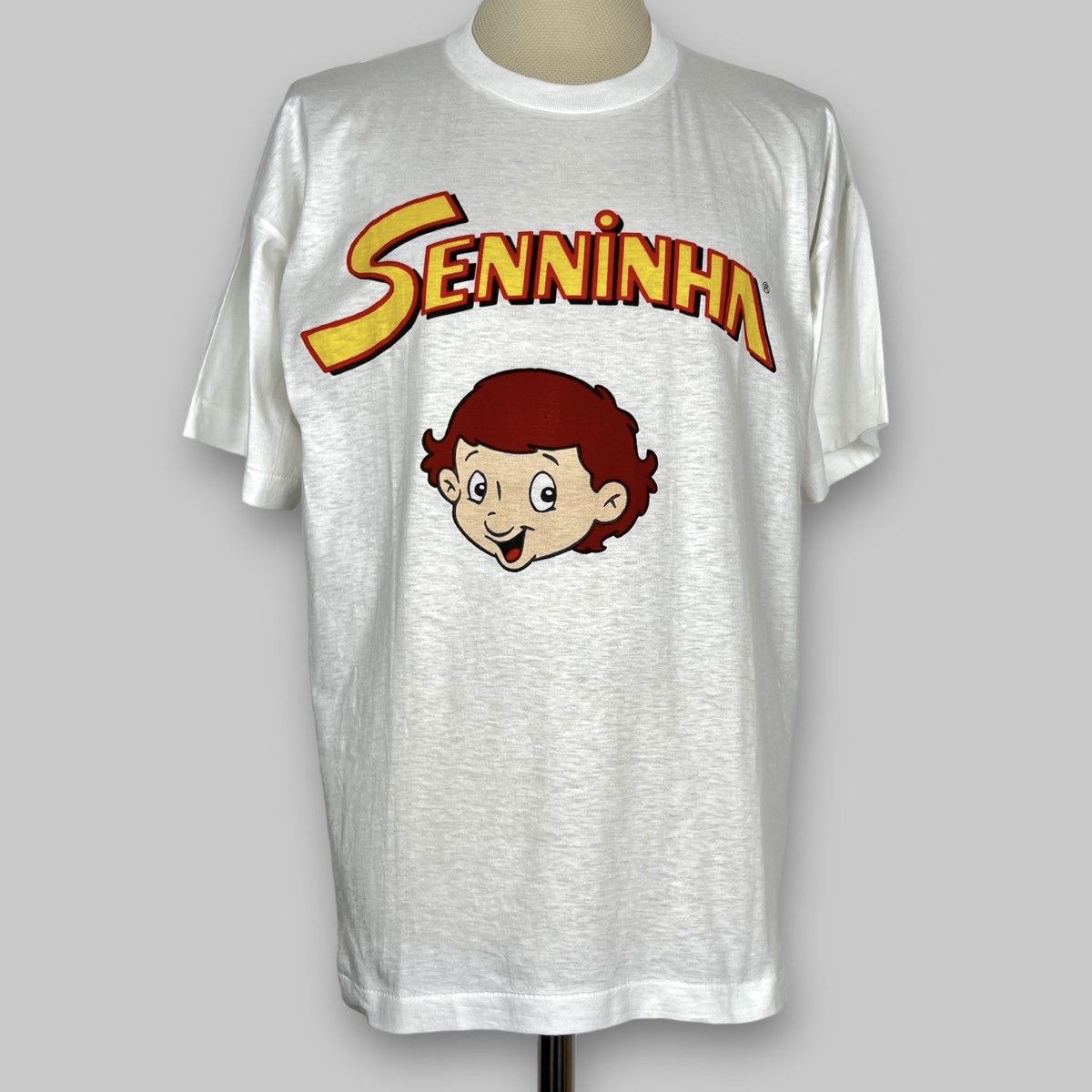 Formula 1 Vintage 90s Ayrton Senna ‘Senninha’ Comic As Worn T Shirt Size US L / EU 52-54 / 3 - 1 Thumbnail