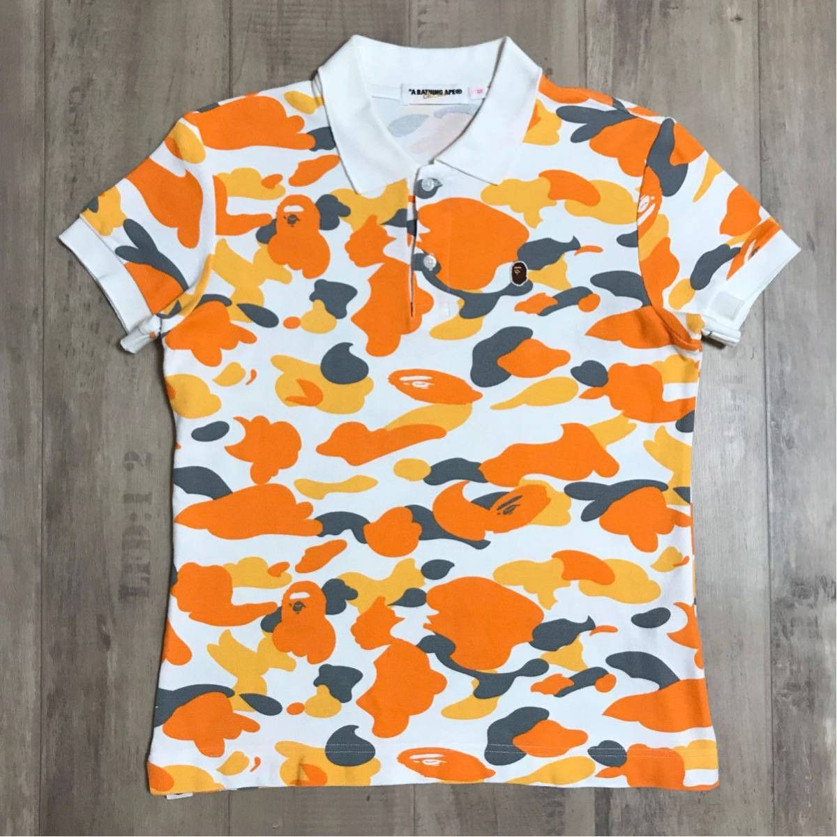 image of Fukuoka City Camo Bape Polo Shirt A Bathing Ape in Orange, Women's (Size Small)