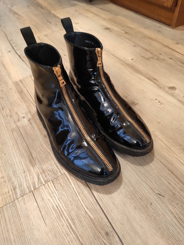 Black polished leather front zip boots.Like Saint Laurent
