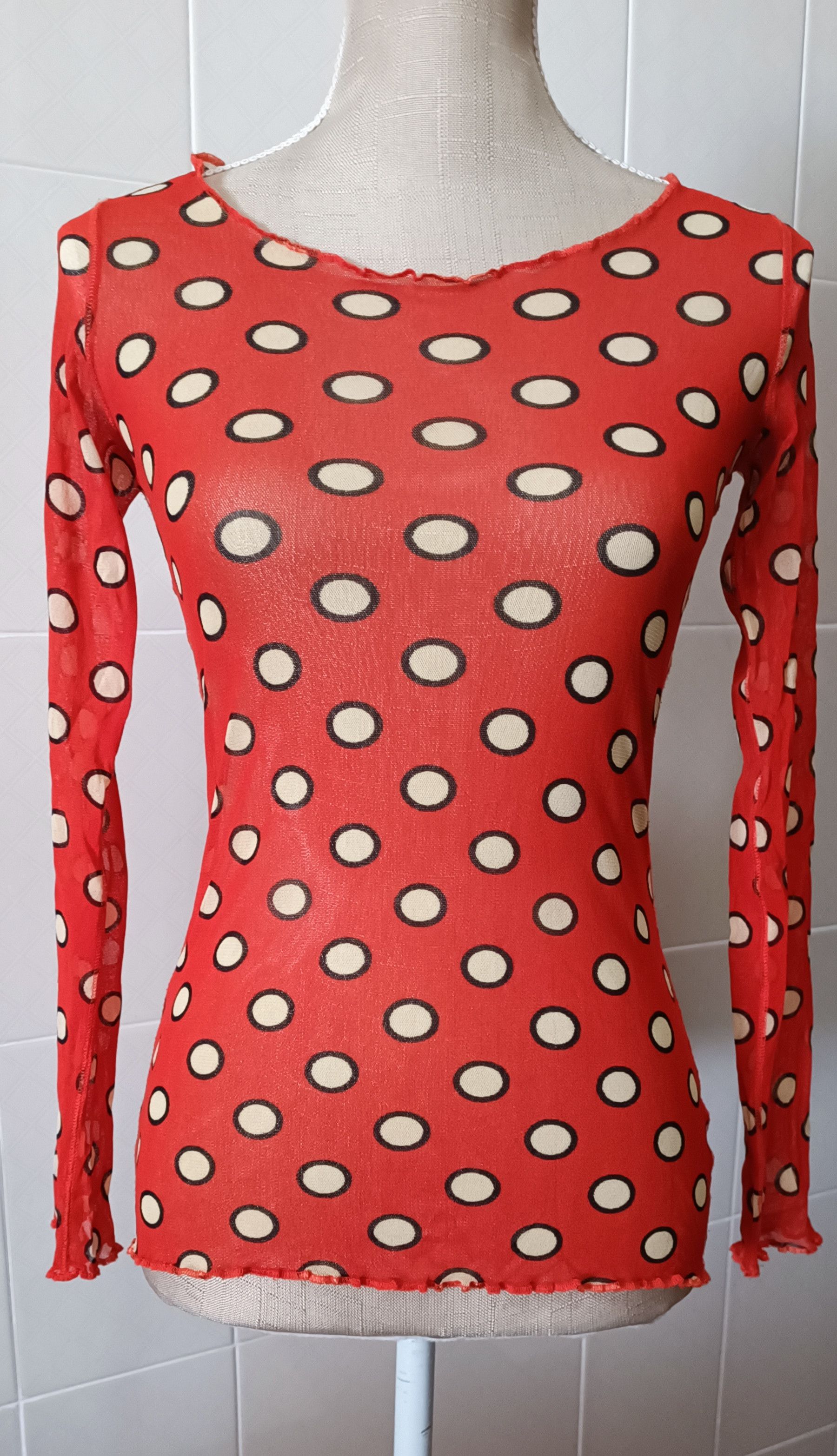 2005_Soleil - nylon mesh orange top with polka