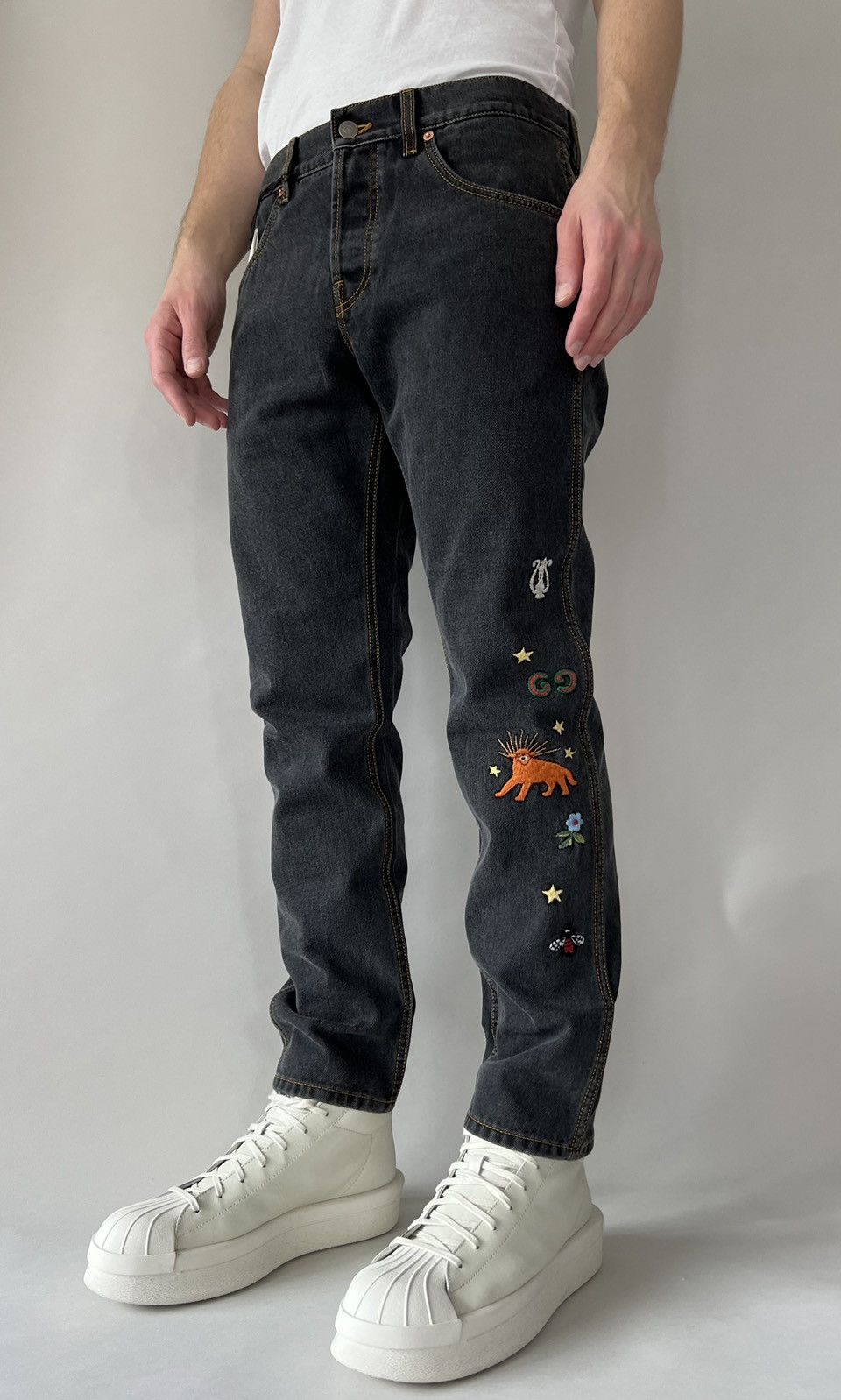 image of $1.4K Value Gucci Logo Embroidered Tiger Patch Denim Jeans in Black, Men's (Size 34)