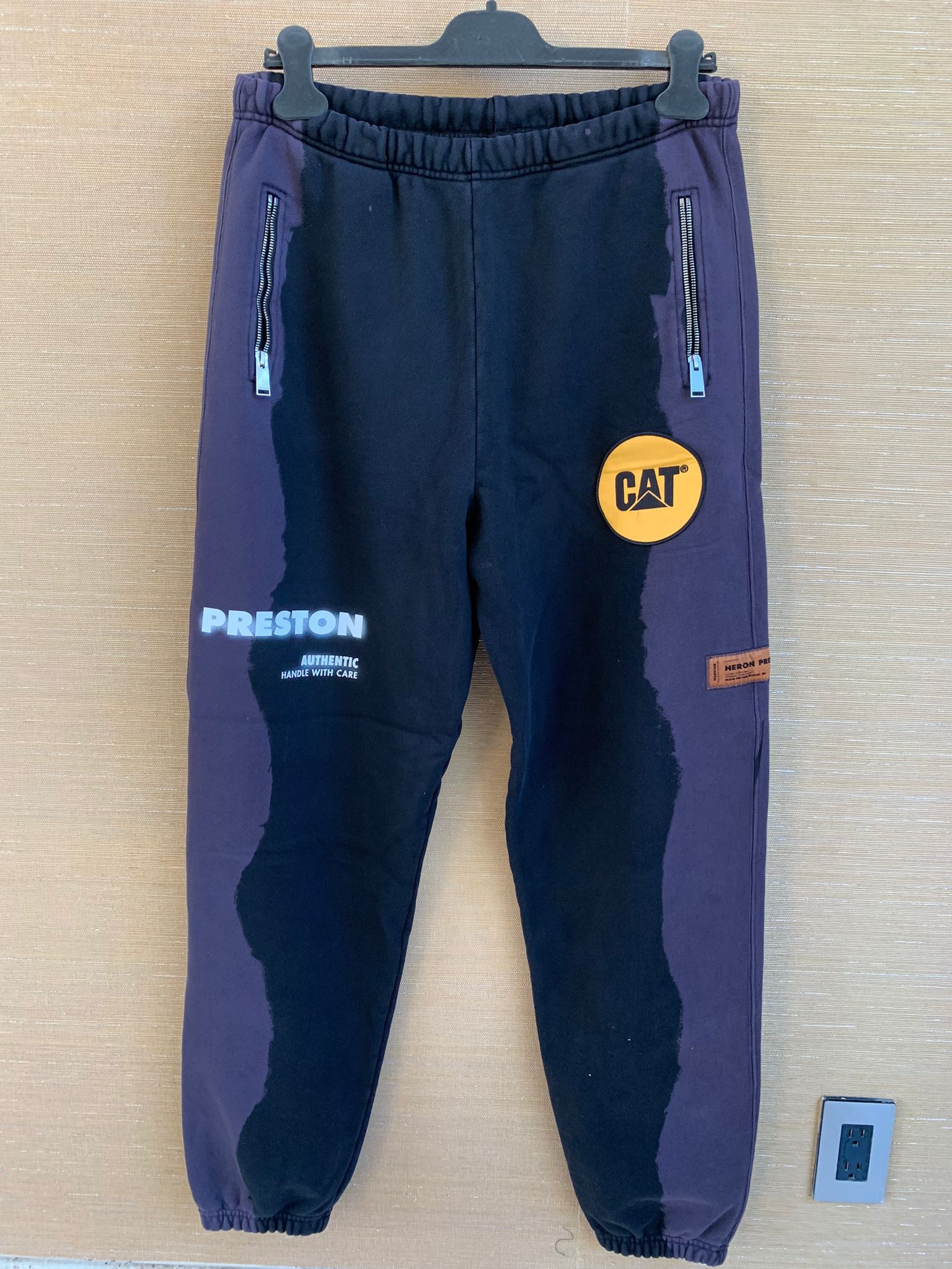 image of Heron Preston Cat Sweatpants Inserts Logo In Black / Grey in Black Grey, Men's (Size 36)