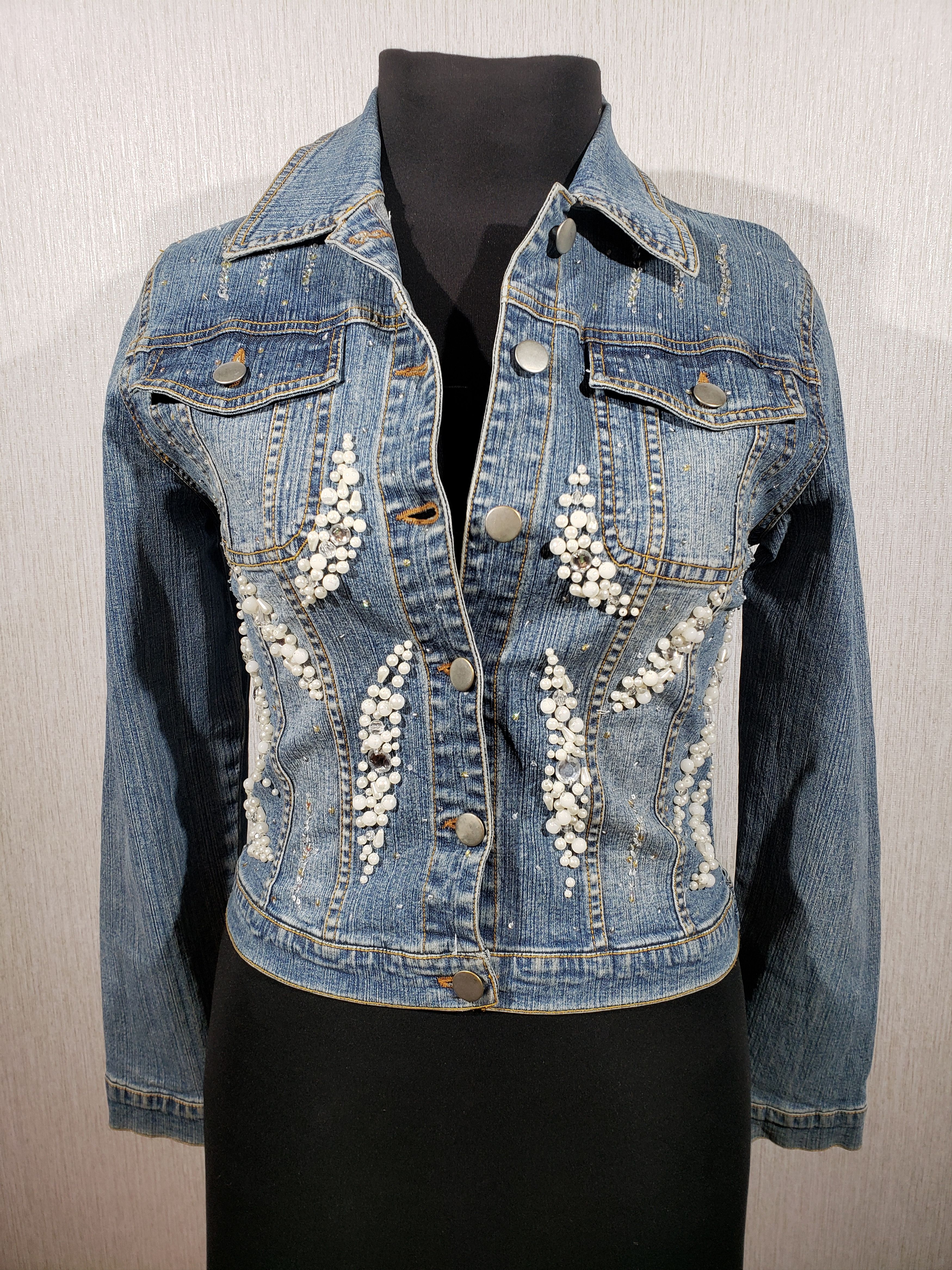 Women's blue jacket with luxurious beaded appliqué.