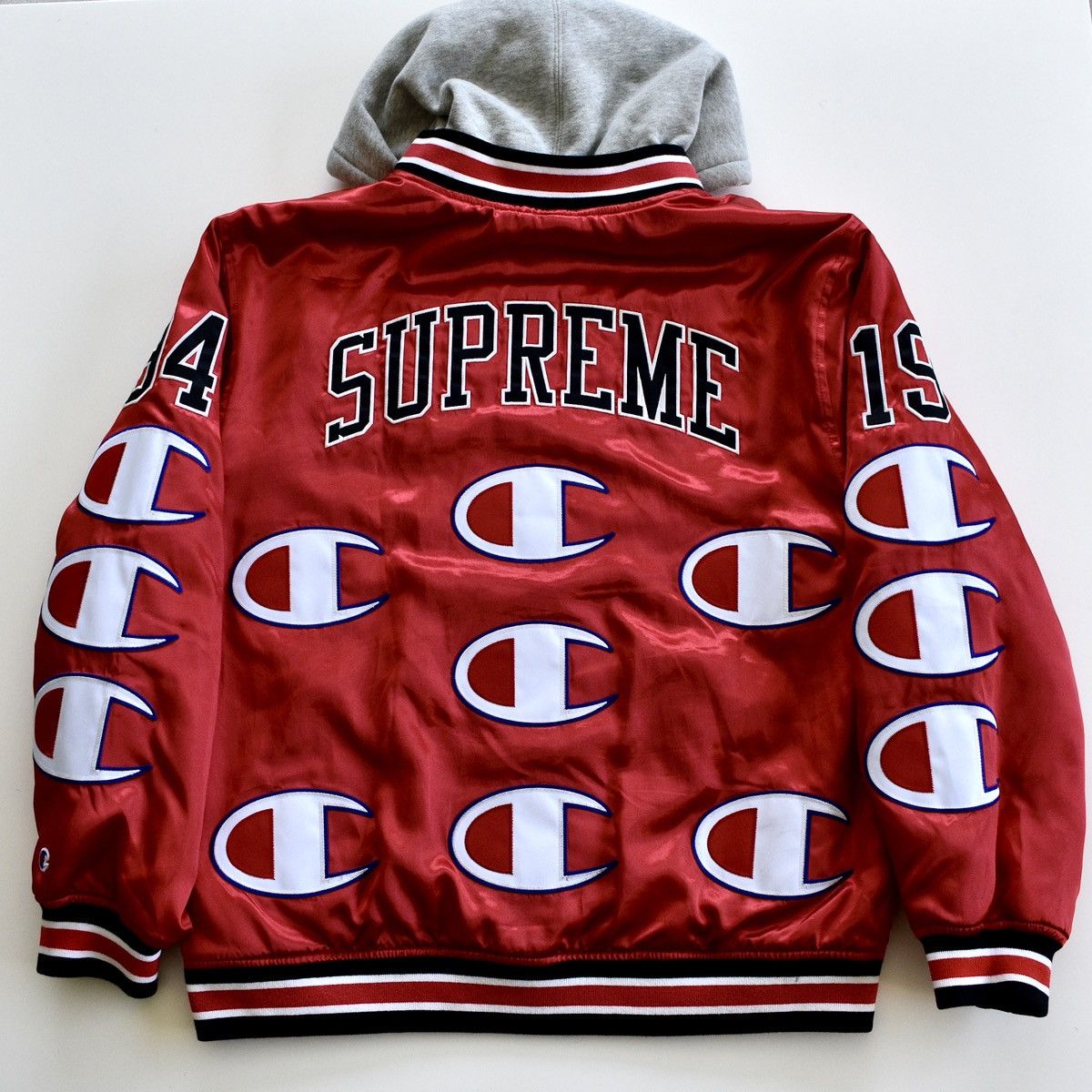 Supreme 🔴 Supreme®/Champion® Hooded Satin Varsity Jacket⁣ | Grailed