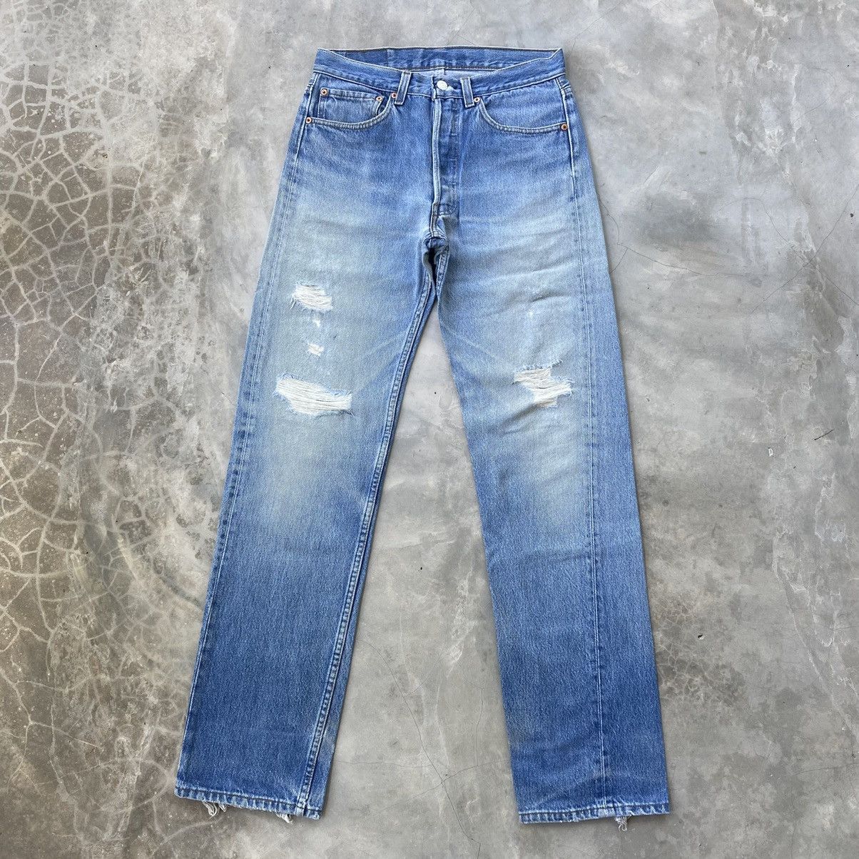 Vintage 90s levis 501 light blue wash distressed denim