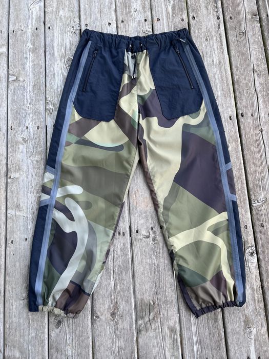 Sacai Kaws Sacai Printed Track Pants Green | Grailed