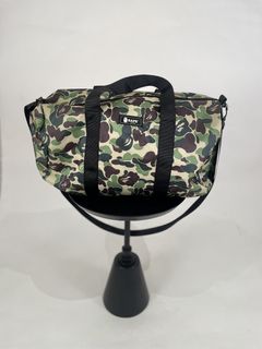 A BATHING APE® x Outdoor Products Camo Duffle Bag - Farfetch