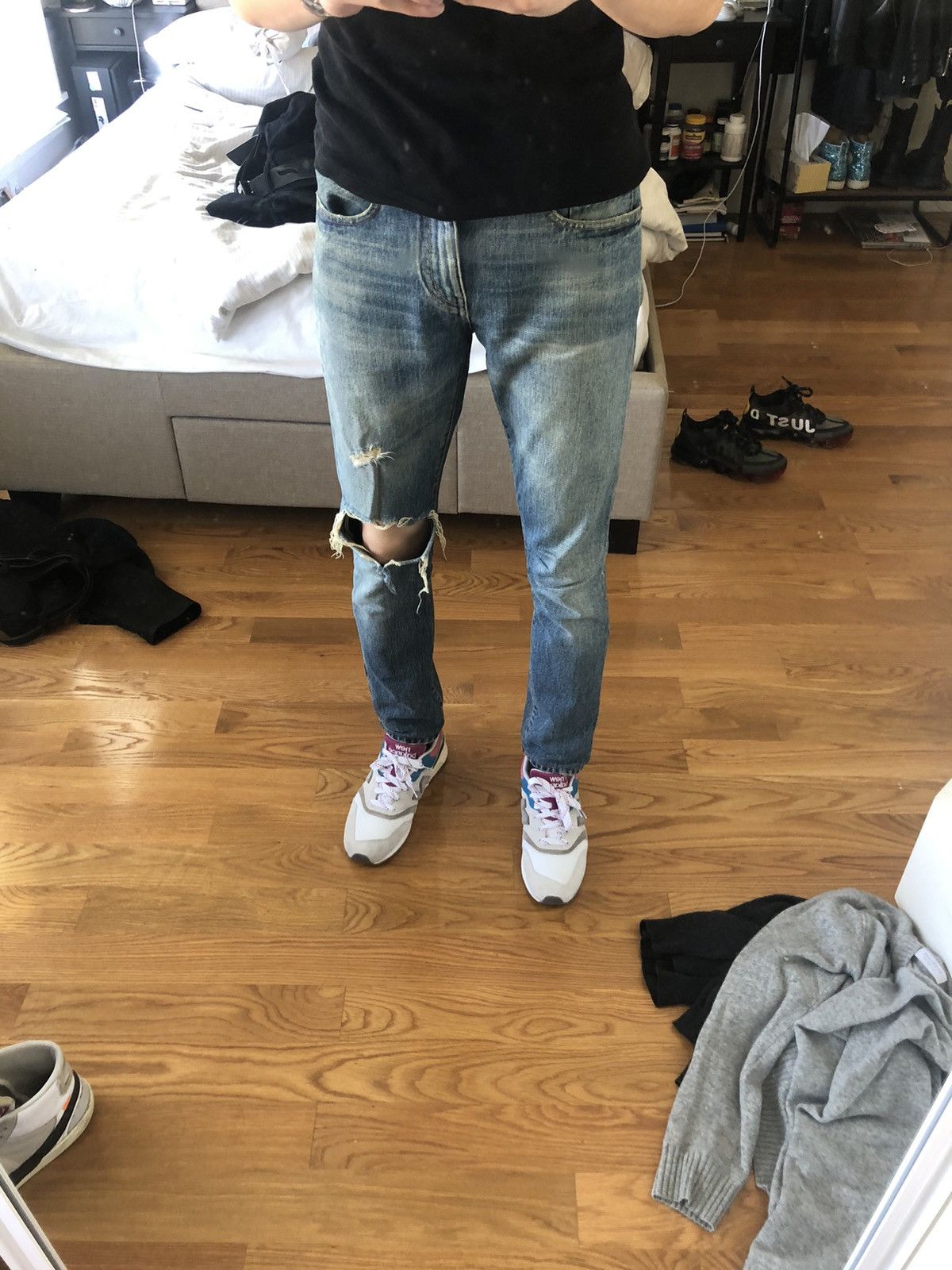 Saint laurent shop ripped knee jeans