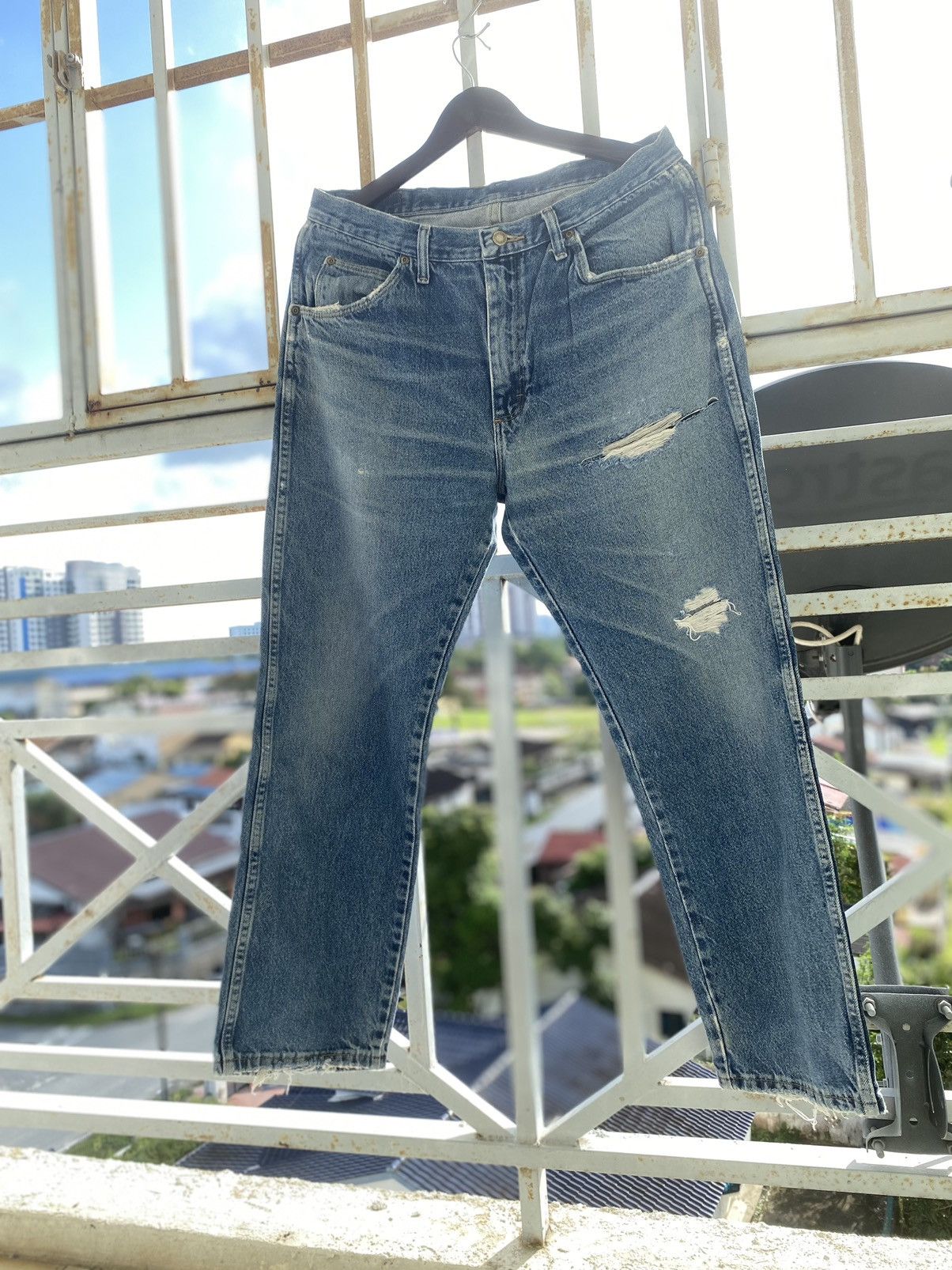 image of Offervintage Distressed Denim Wrangler Faded Blue Jeans, Men's (Size 34)