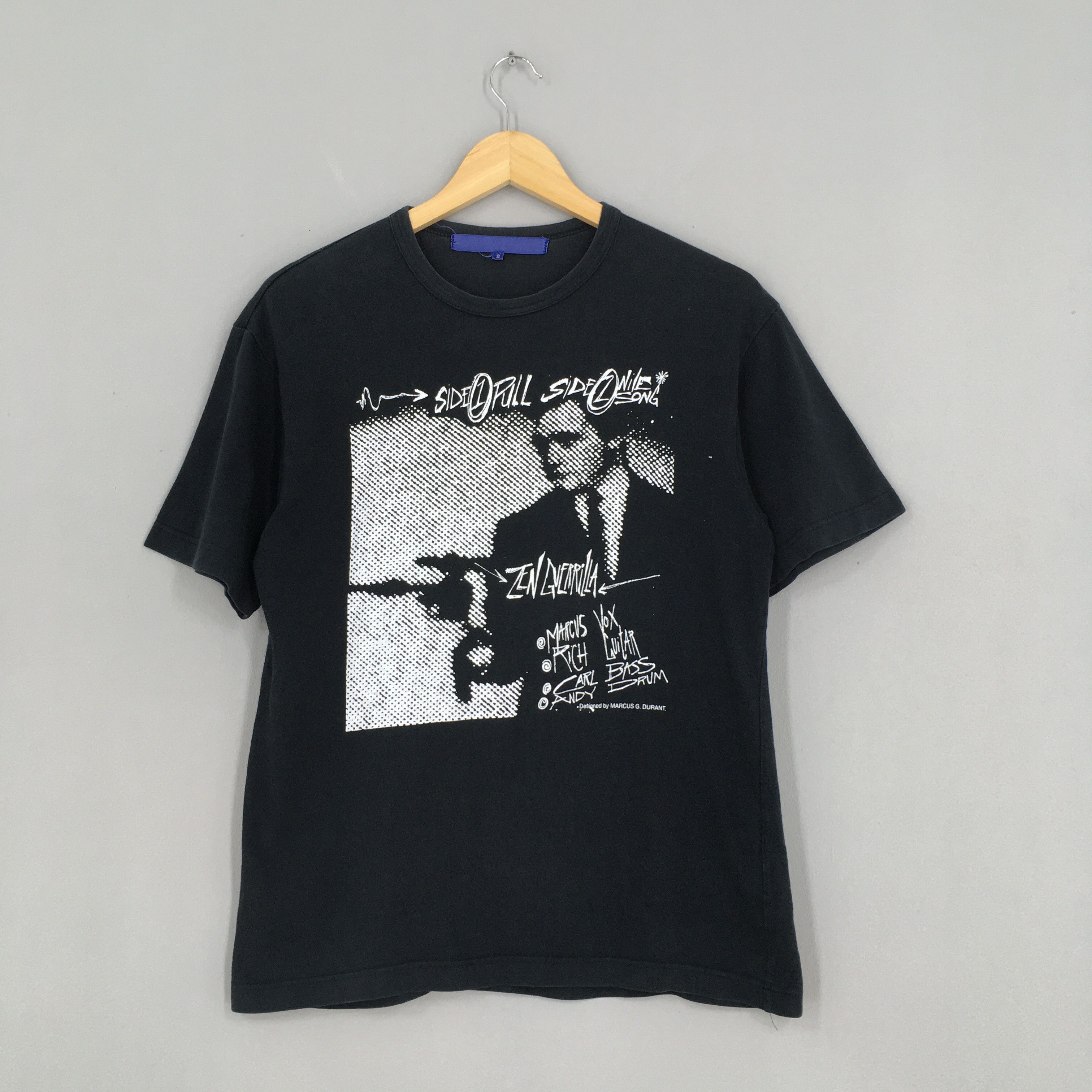 image of Comme Des Garcons Zen Guerrilla Rock Band Tshirt Small in Black, Men's