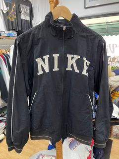 Nike unisex retro collegiate varsity jacket in archaeo brown