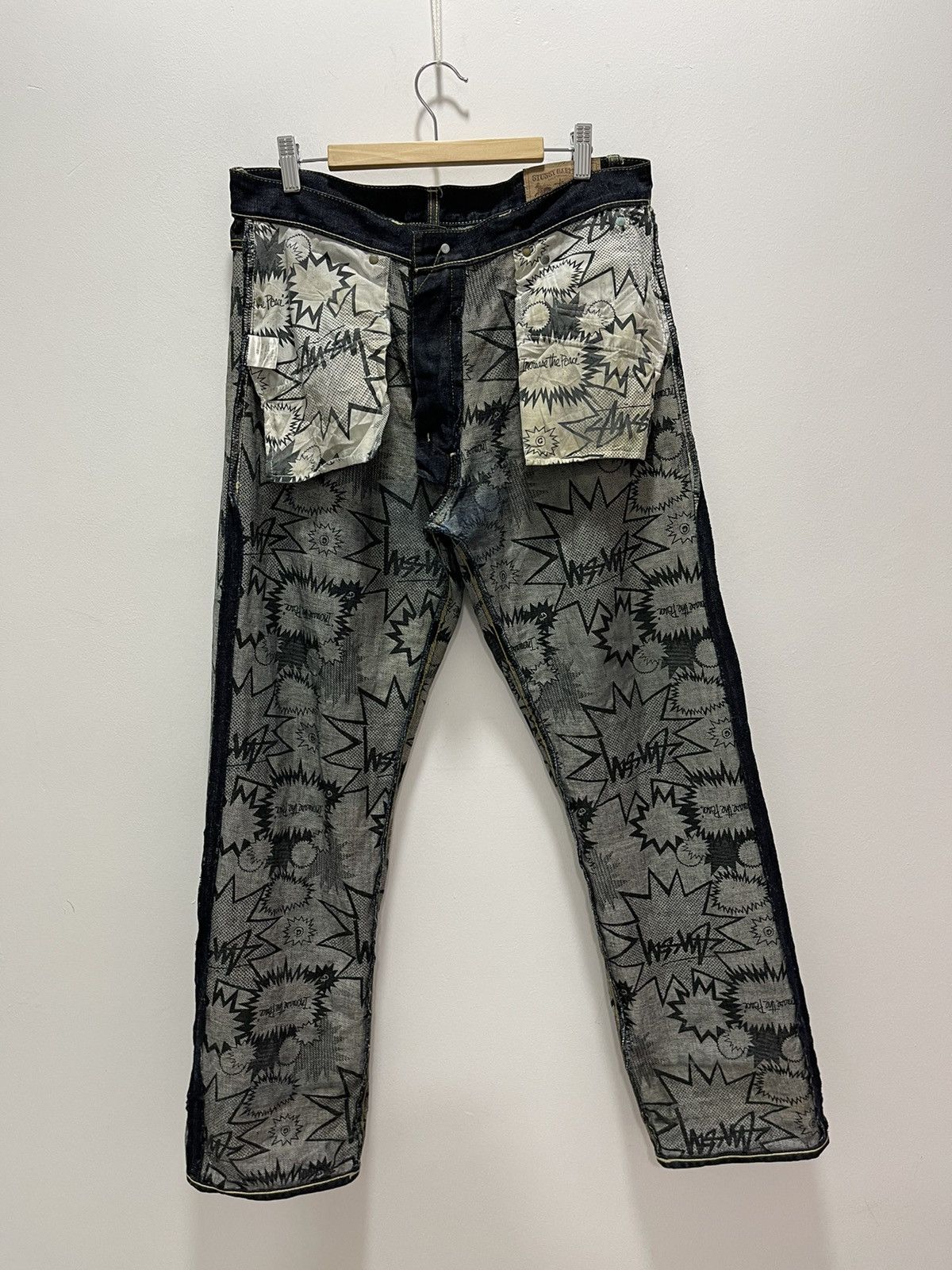 image of Vintage Stussy Rough Art Design Distressed Denim Jeans in Dark Blue, Men's (Size 32)