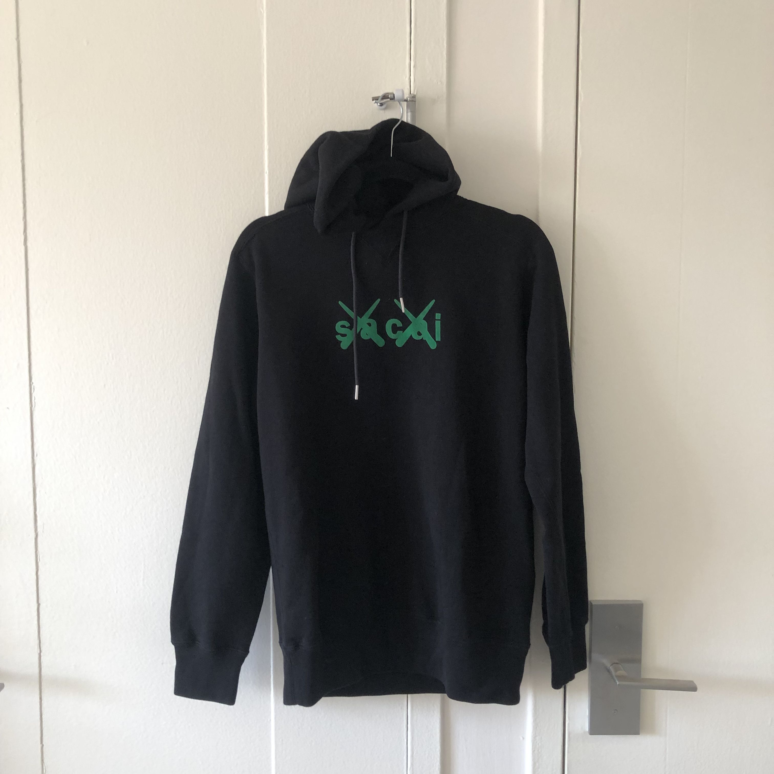 image of Kaws x Sacai Hoodie in Black, Men's (Size Medium)