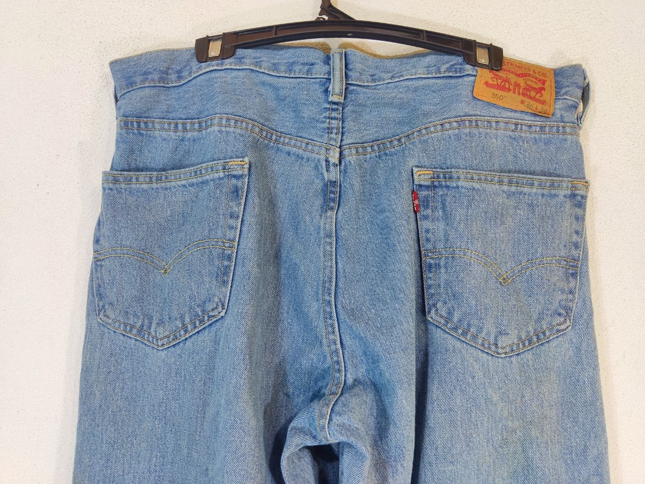 Levi's levis 550 relaxed fit light wash distressed denim Size US 39 - 12 Thumbnail
