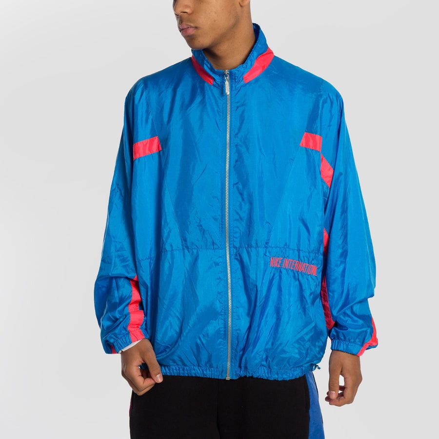 Nike × Vintage 90s Nike International Vintage nylon track jacket Size US L / EU 52-54 / 3 - 1 Thumbnail