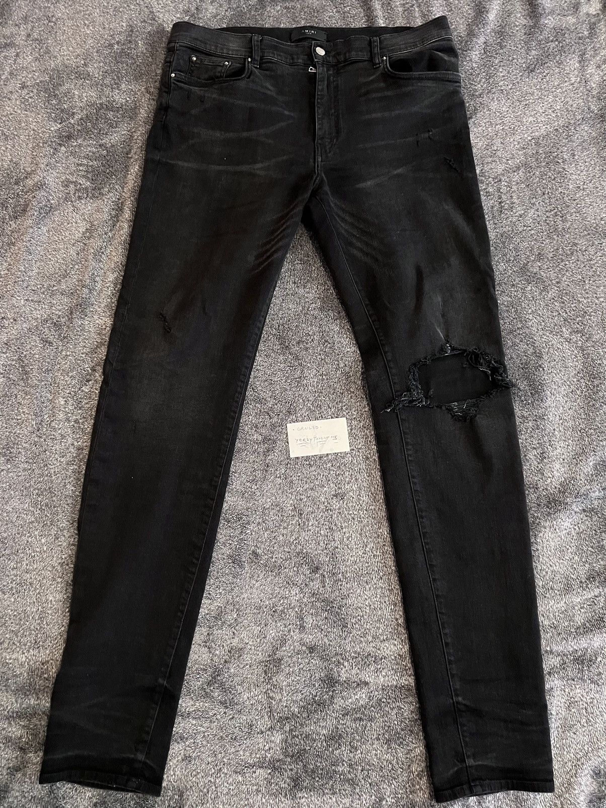 image of Amiri Stack Broken Jeans 38 in Black, Men's