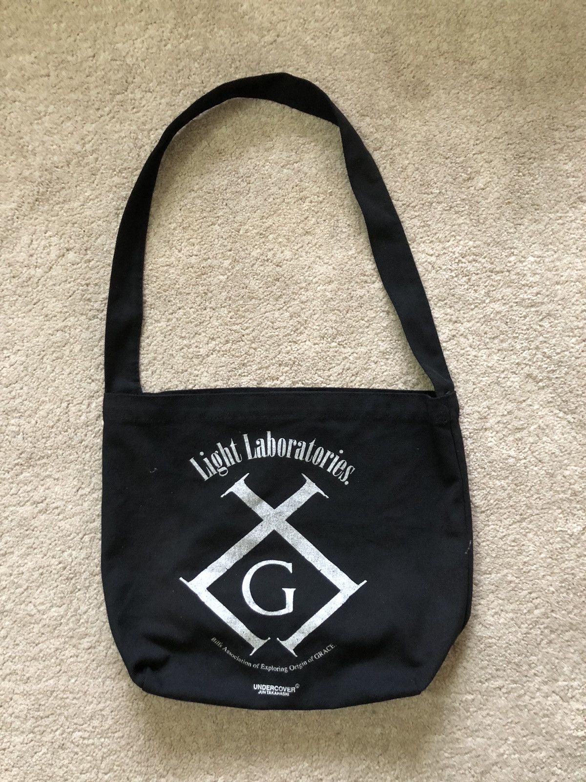 image of Jun Takahashi x Undercover Grace Light Laboratories Sling Bag in Black, Men's