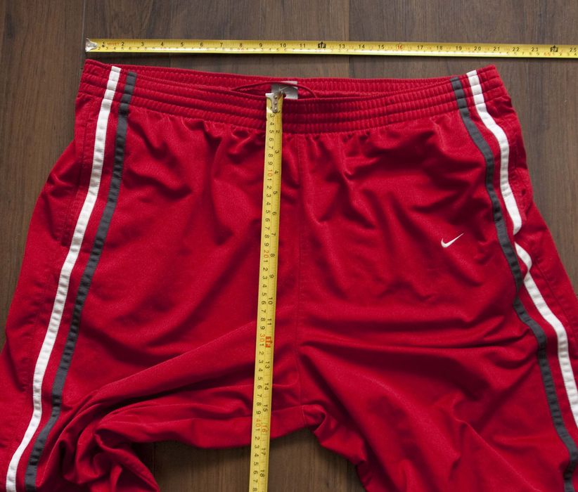 mens red nike track pants