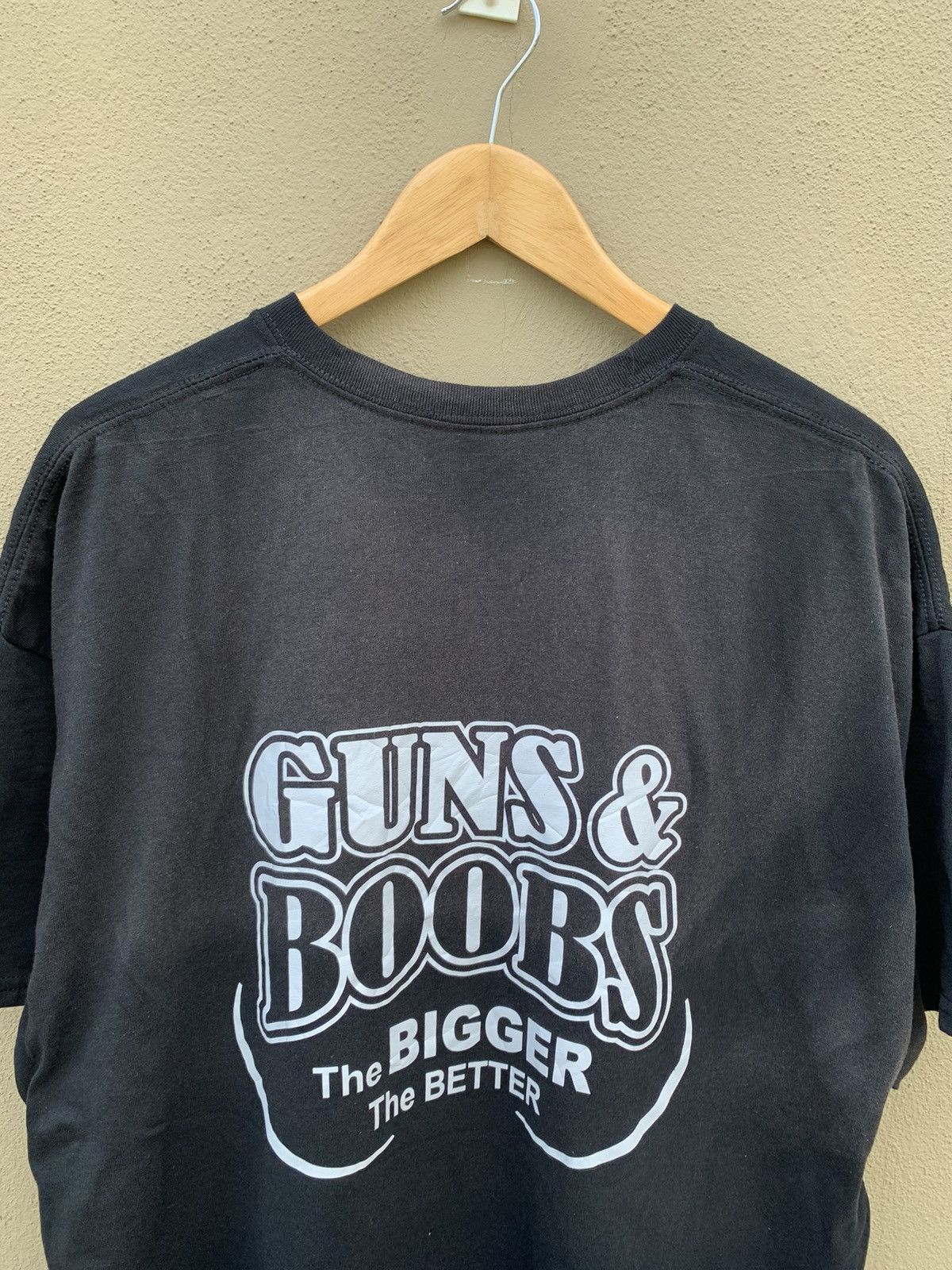 image of Vintage Guns And Boobs The Bigger The Better Printed Tee in Black, Men's (Size 2XL)