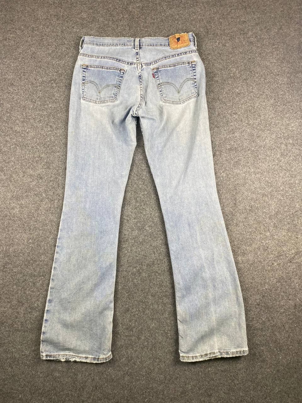 image of Vintage Levis 515 Stretch Bootcut Flare Distressed Denim in Light Blue, Women's (Size 33)