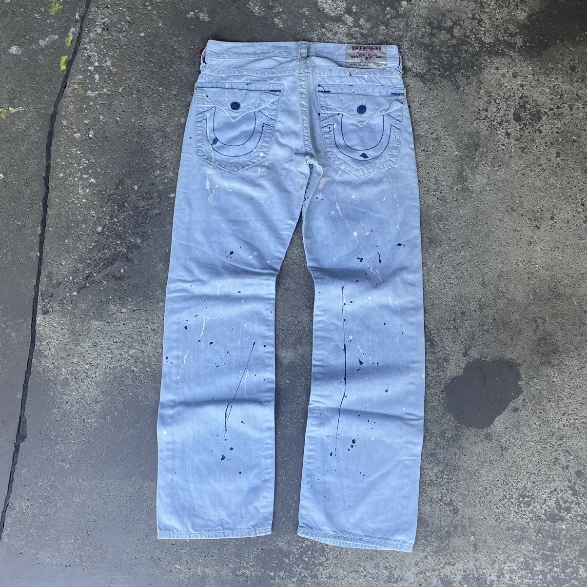 TRUE RELIGION PAINT SPLATTER LIGHT WASH DISTRESSED JEANS
