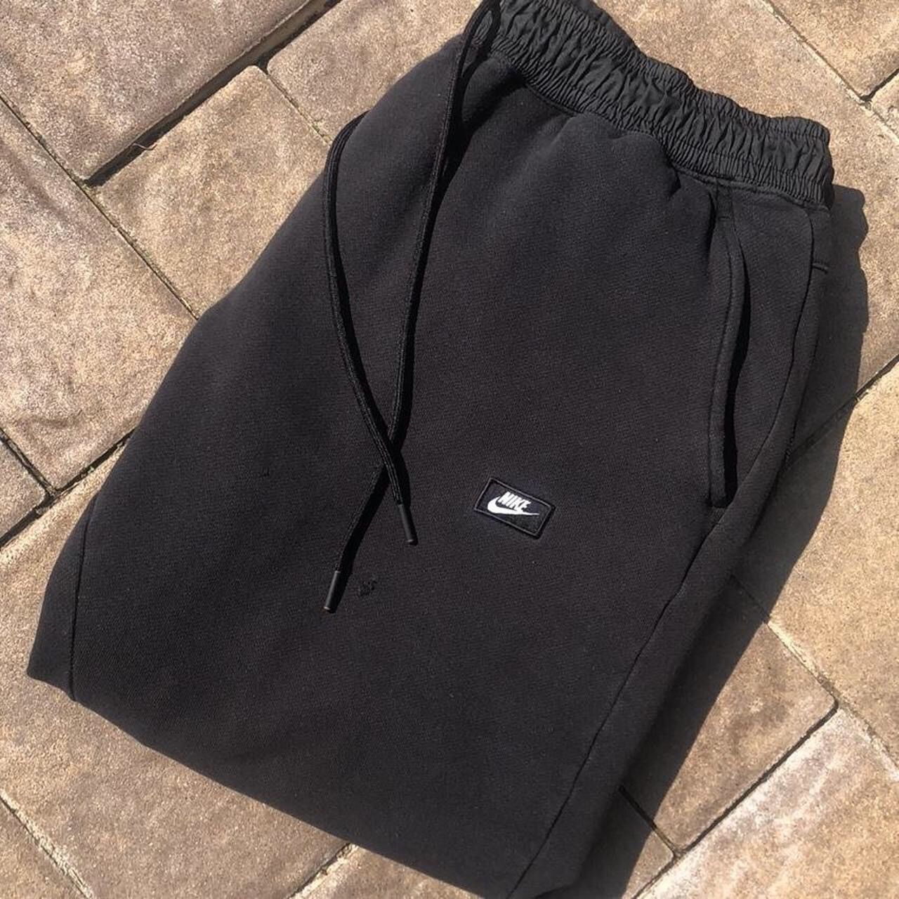 red nike swoosh joggers