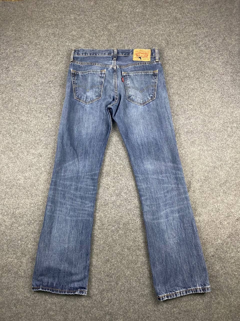 image of Levis 527 Uneven Faded Flare Bootcut Denim in Light Blue, Men's (Size 32)