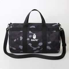 A BATHING APE® x Outdoor Products Camo Duffle Bag - Farfetch